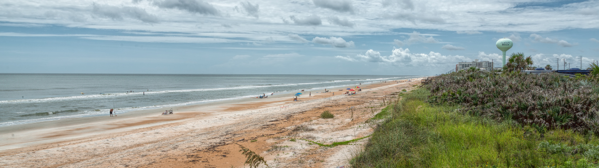 A beach with people on it.