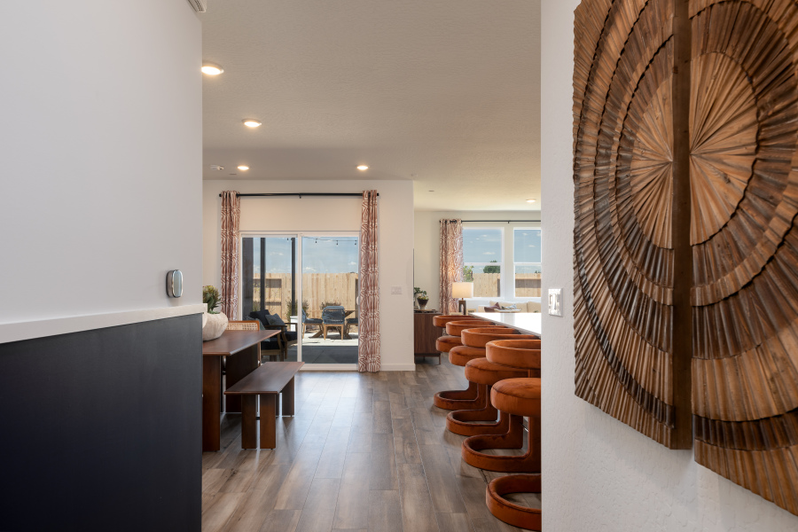 A room with a desk and chairs.