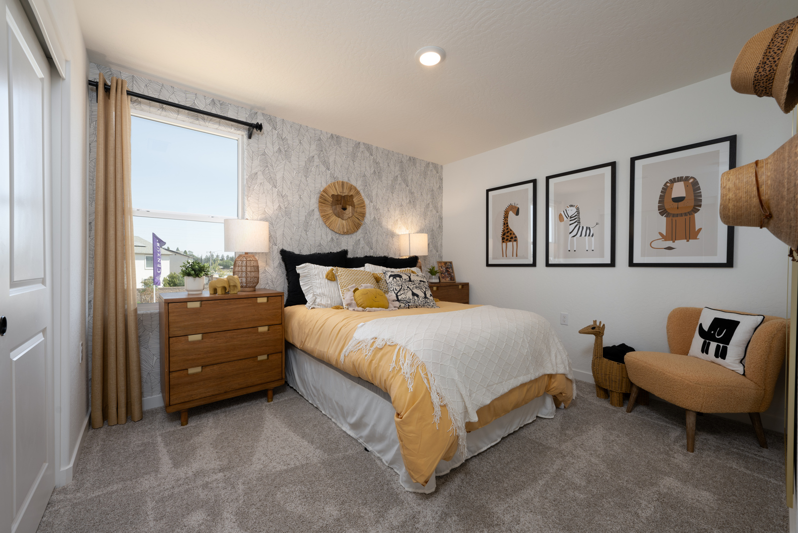 A bedroom with a bed and a chair.