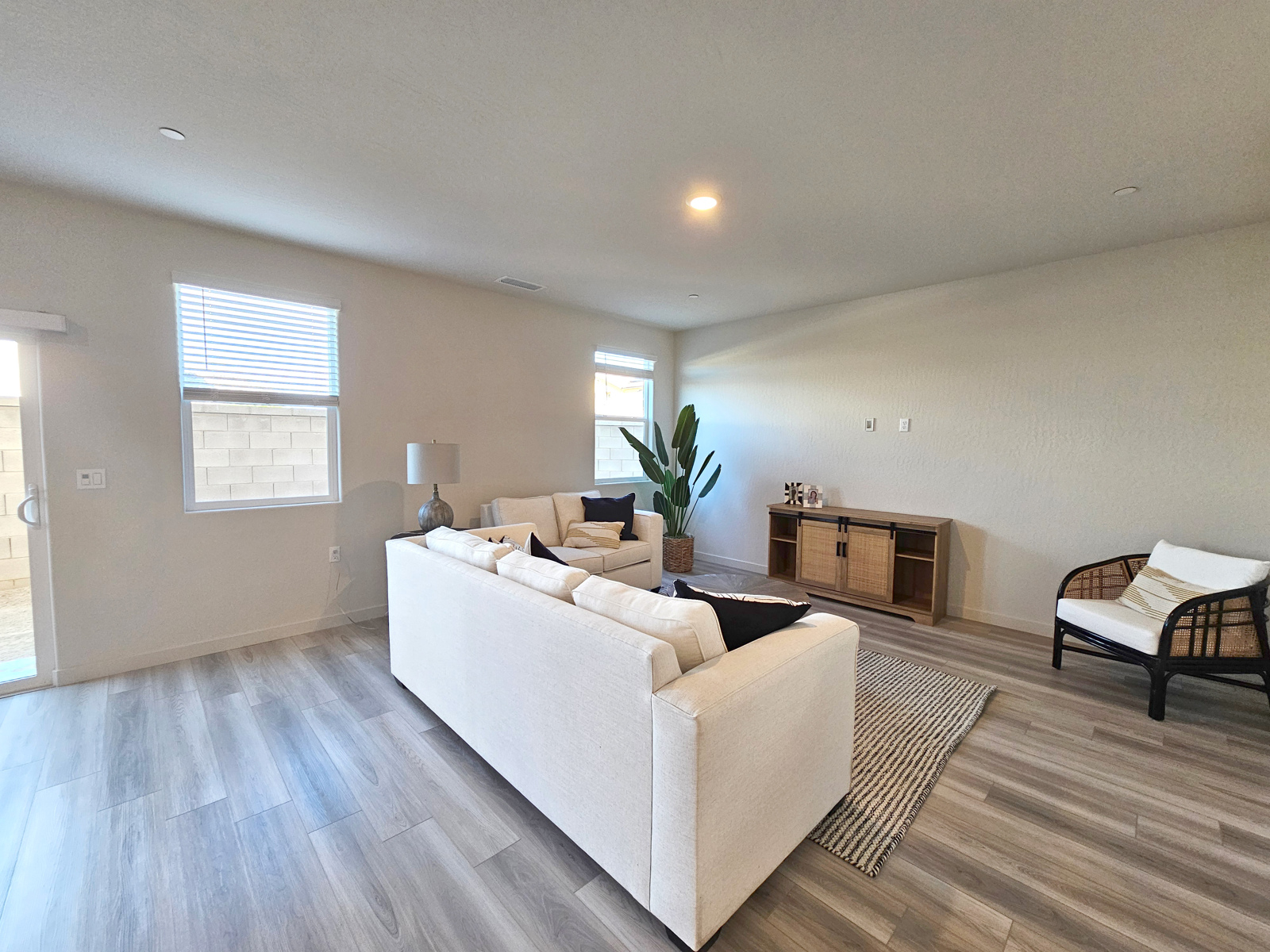 A living room with a white couch.