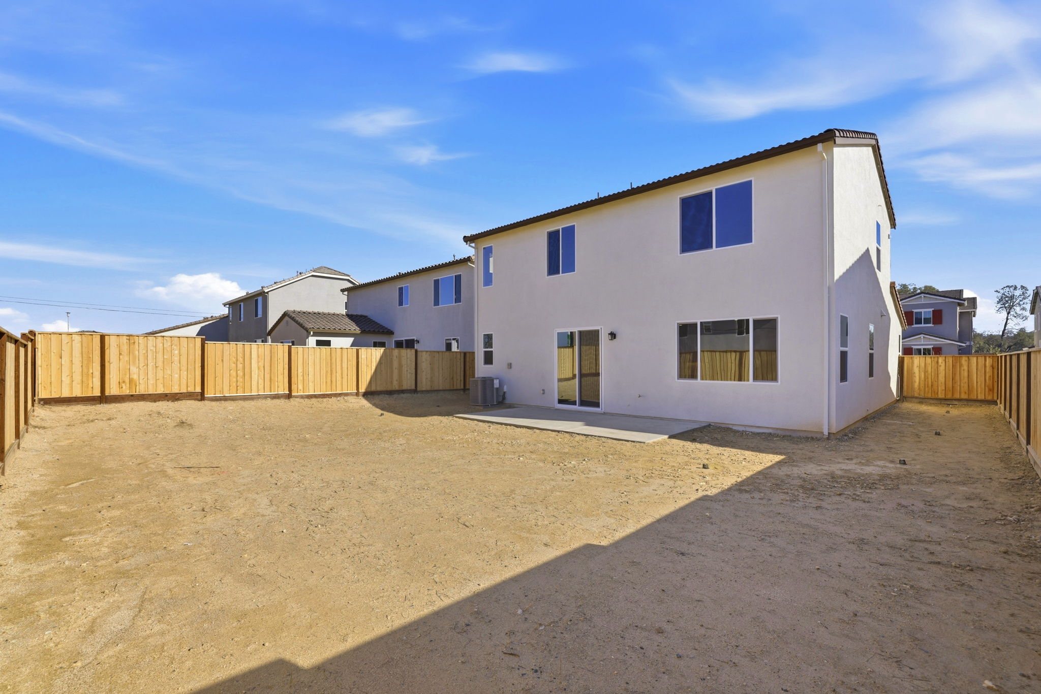 A white house with blue windows.