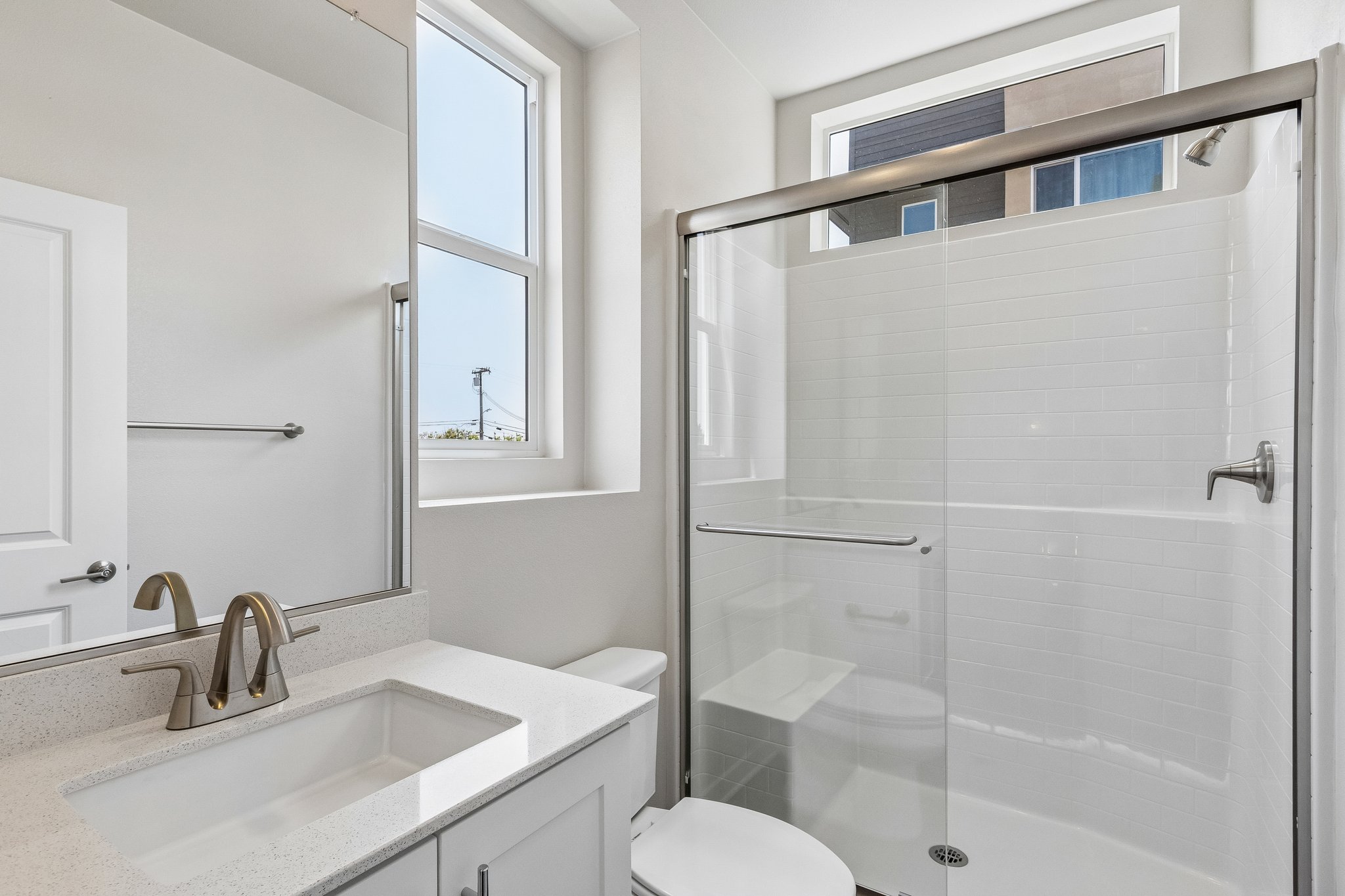 A bathroom with a glass shower.