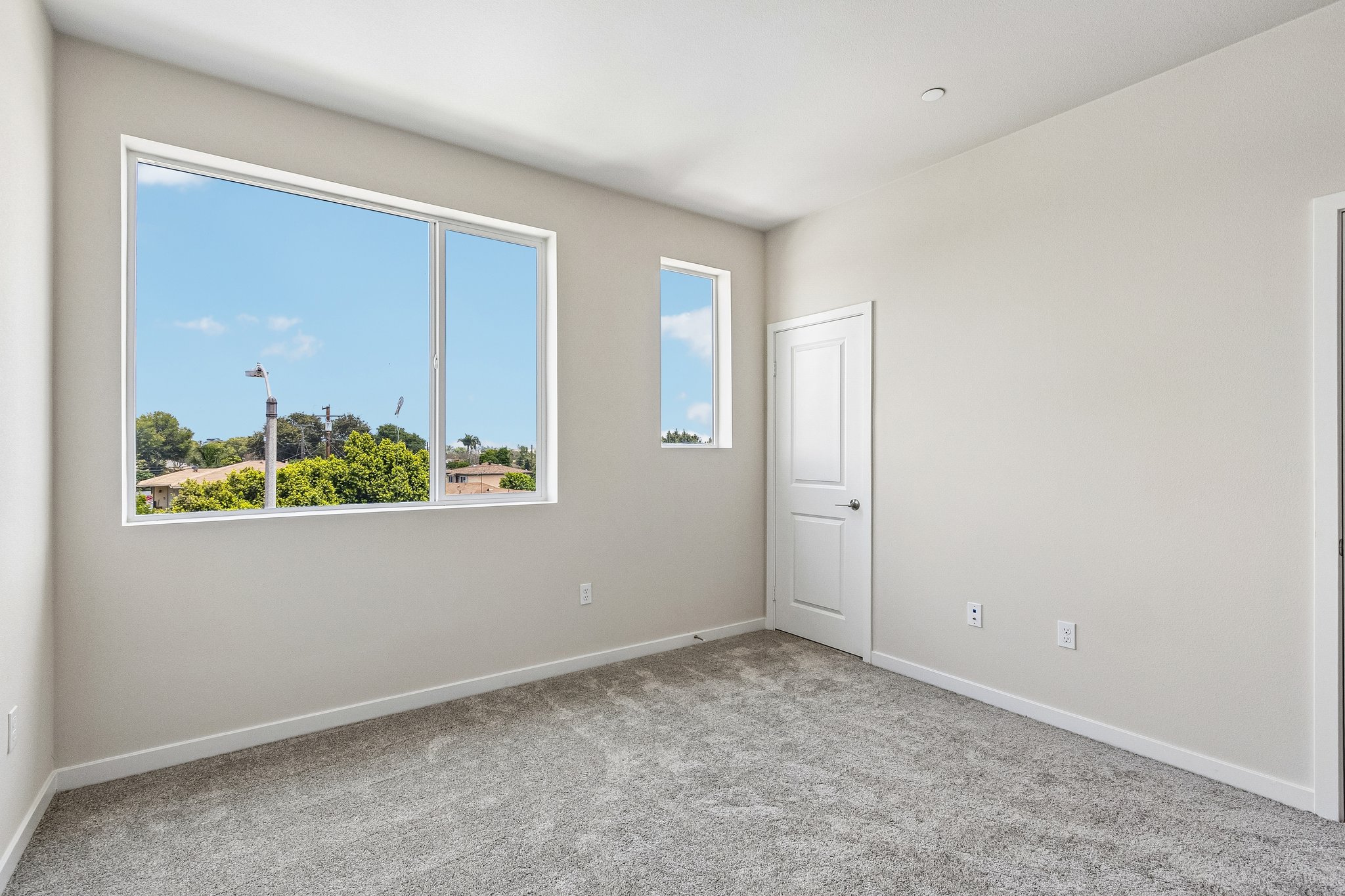 A room with a window and a door.
