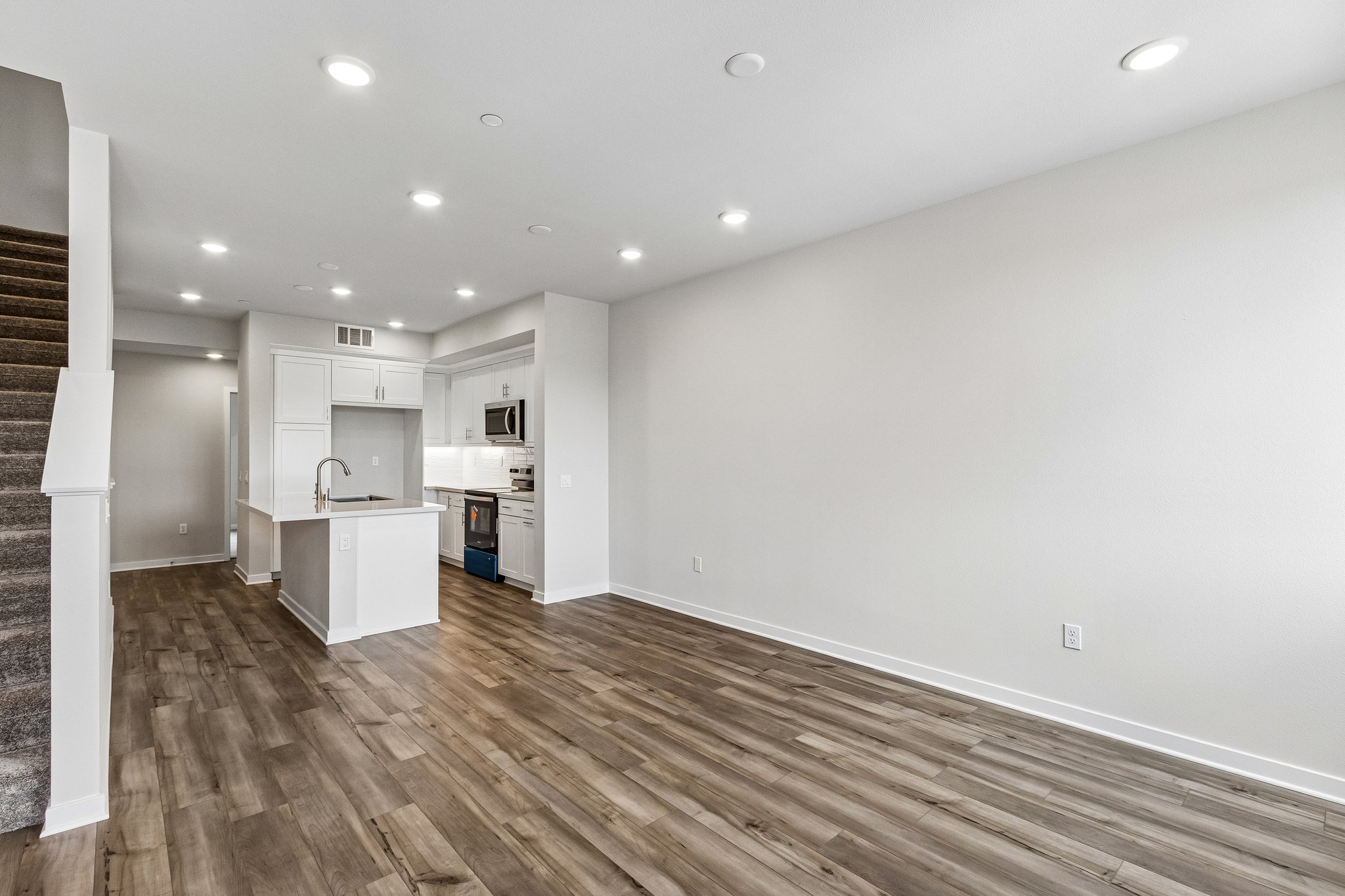 A kitchen with white walls.