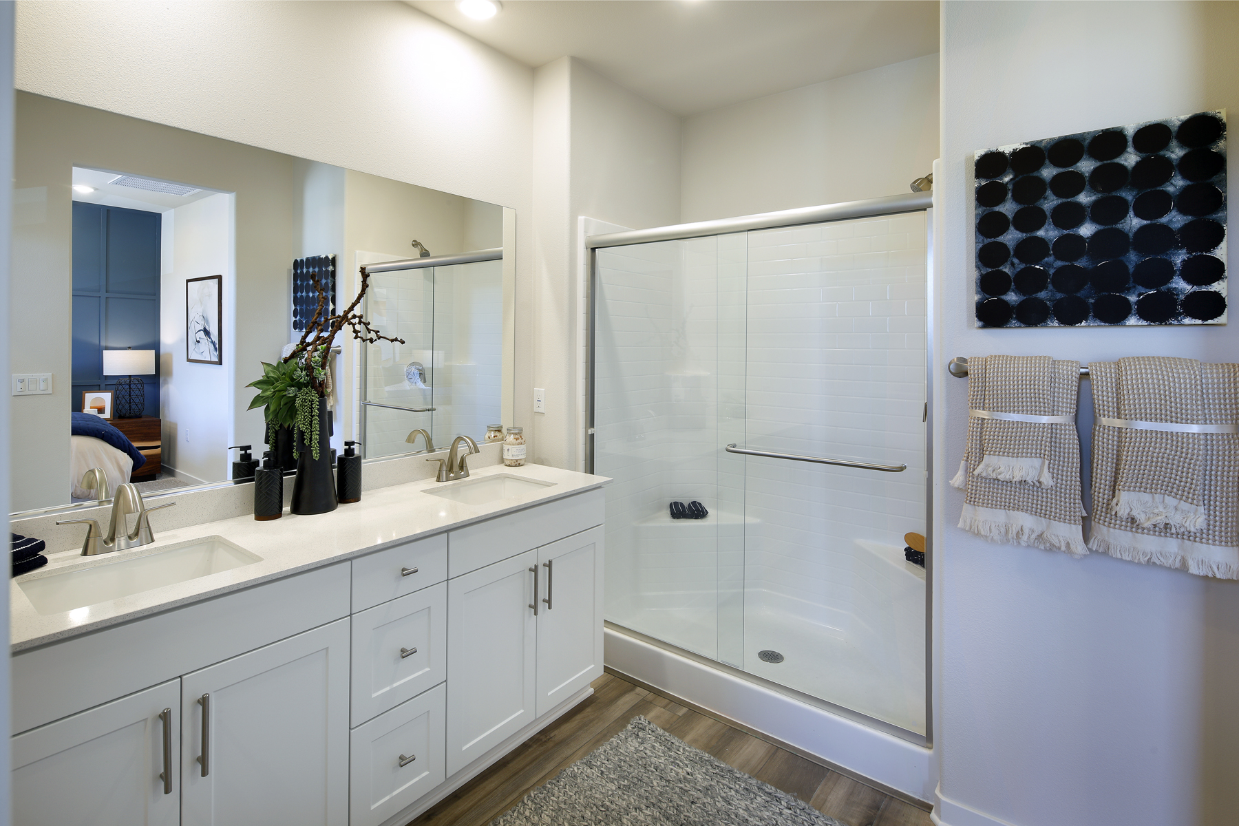 A bathroom with a shower and sink.