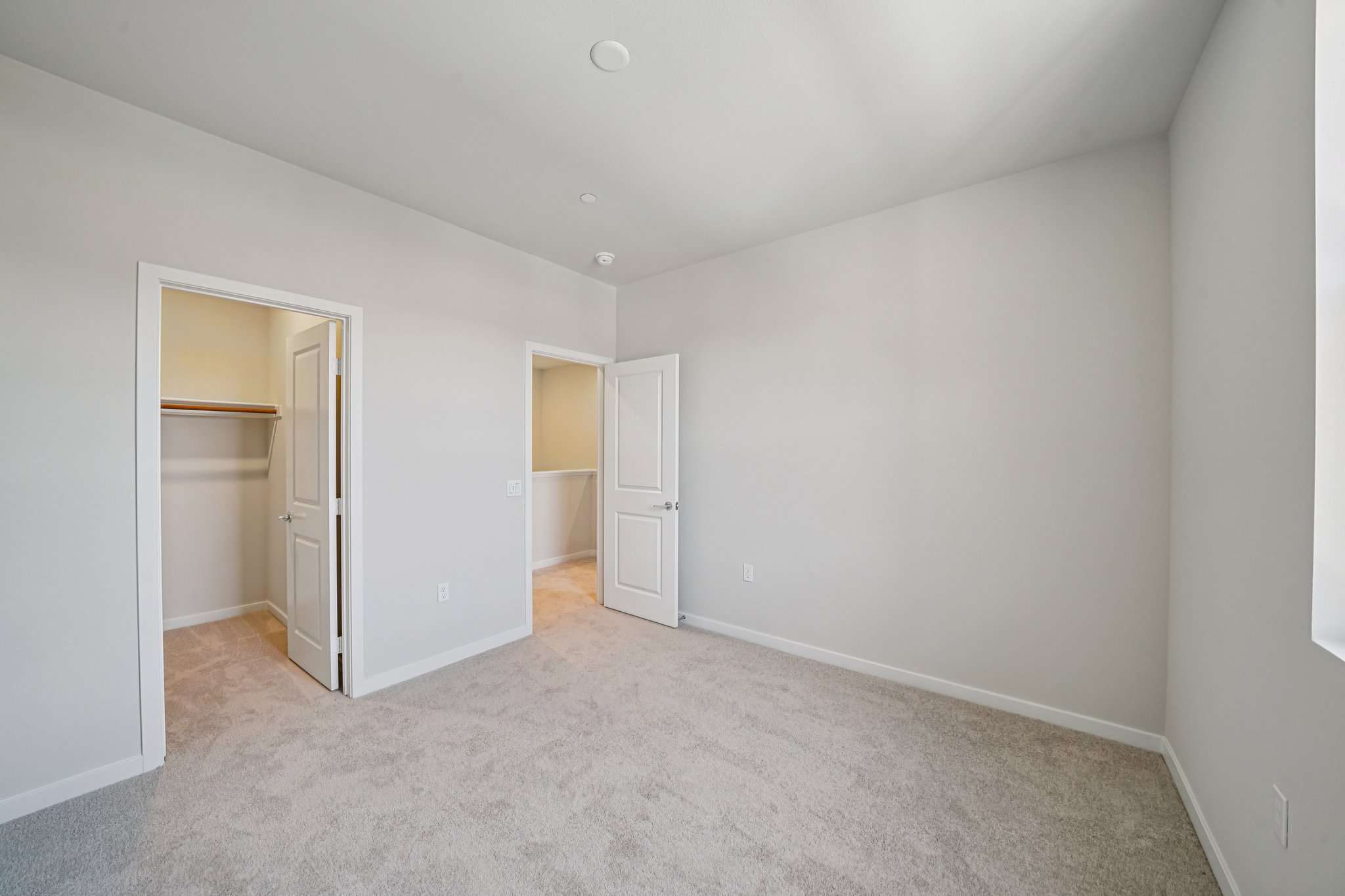 A hallway with white walls.