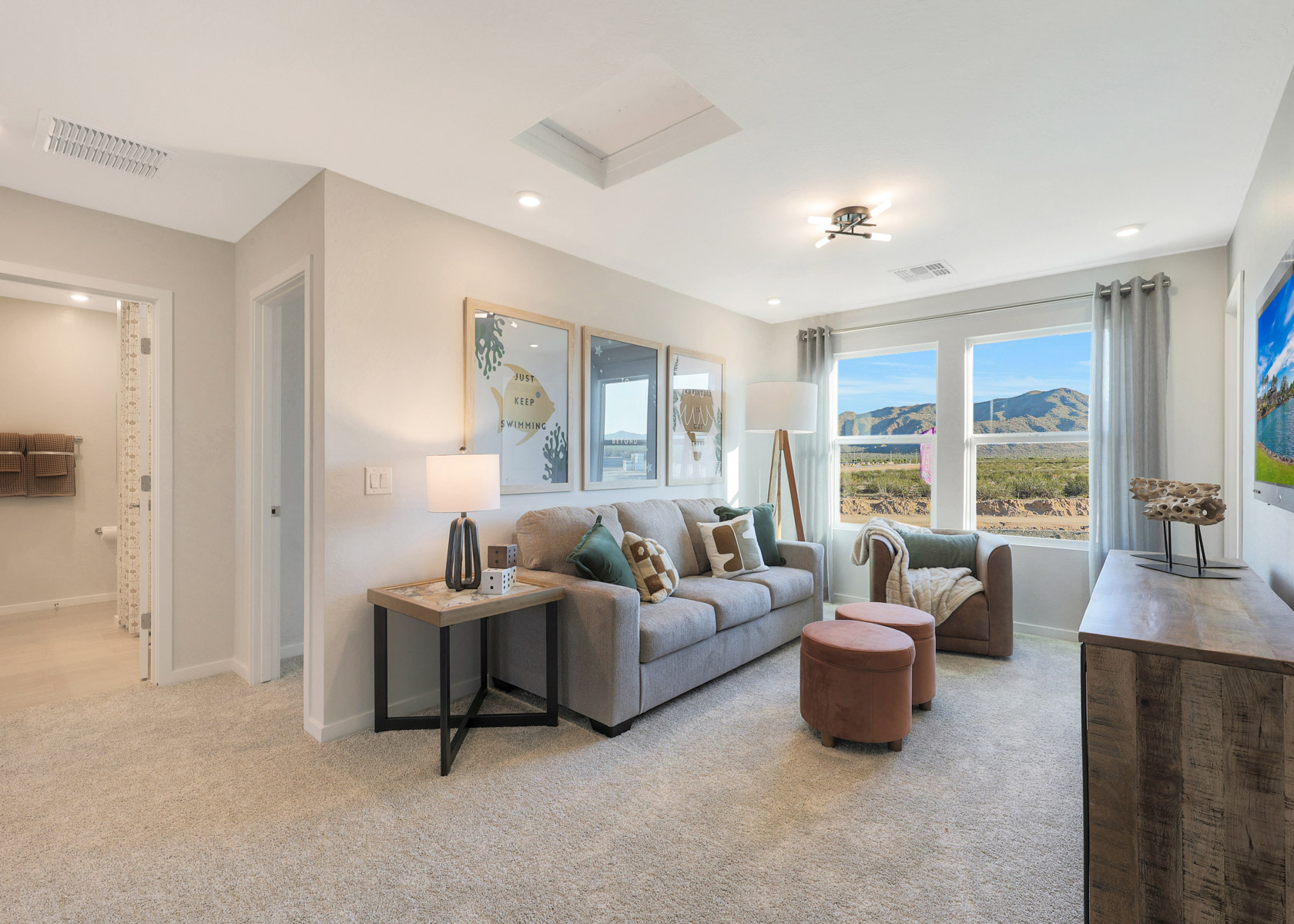 A living room with a large window.