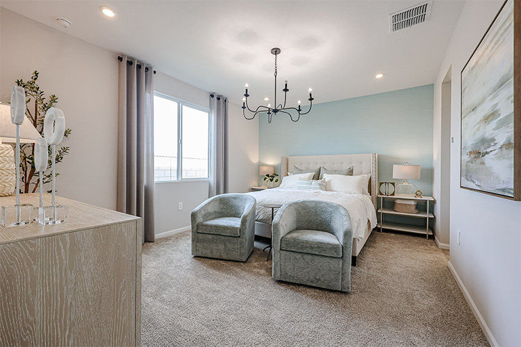 A bedroom with a bed and a couch.