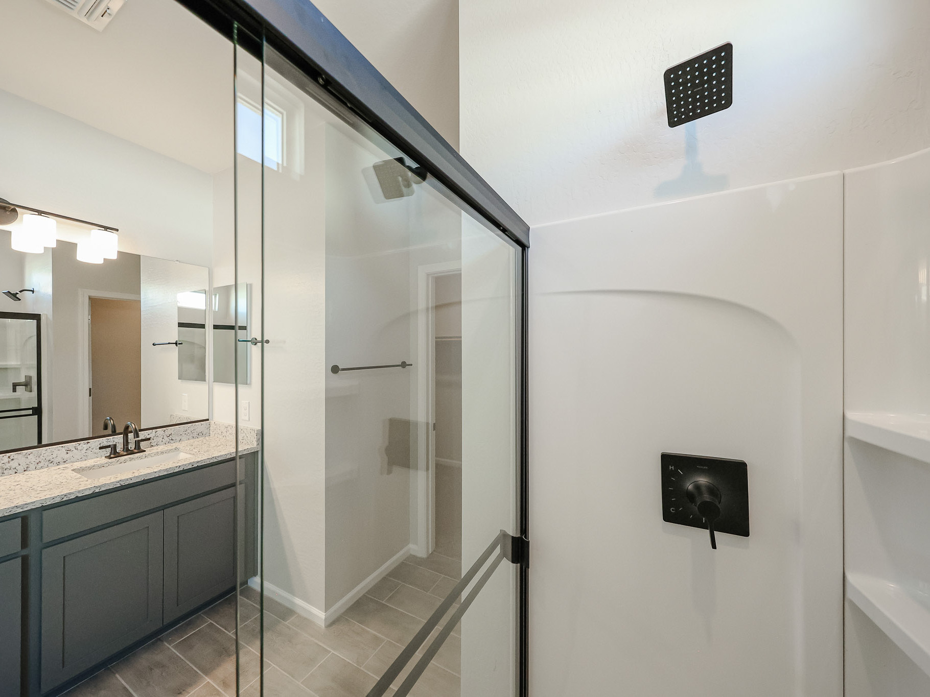 A bathroom with a glass shower.