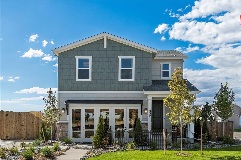 A house with a fence and trees.