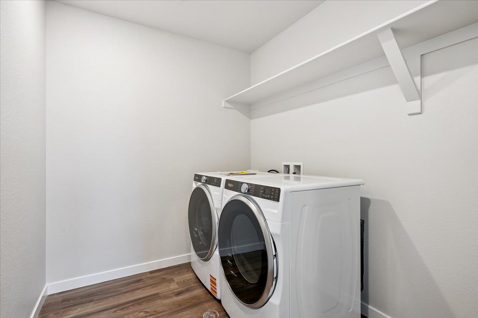 A white washing machine in a room.