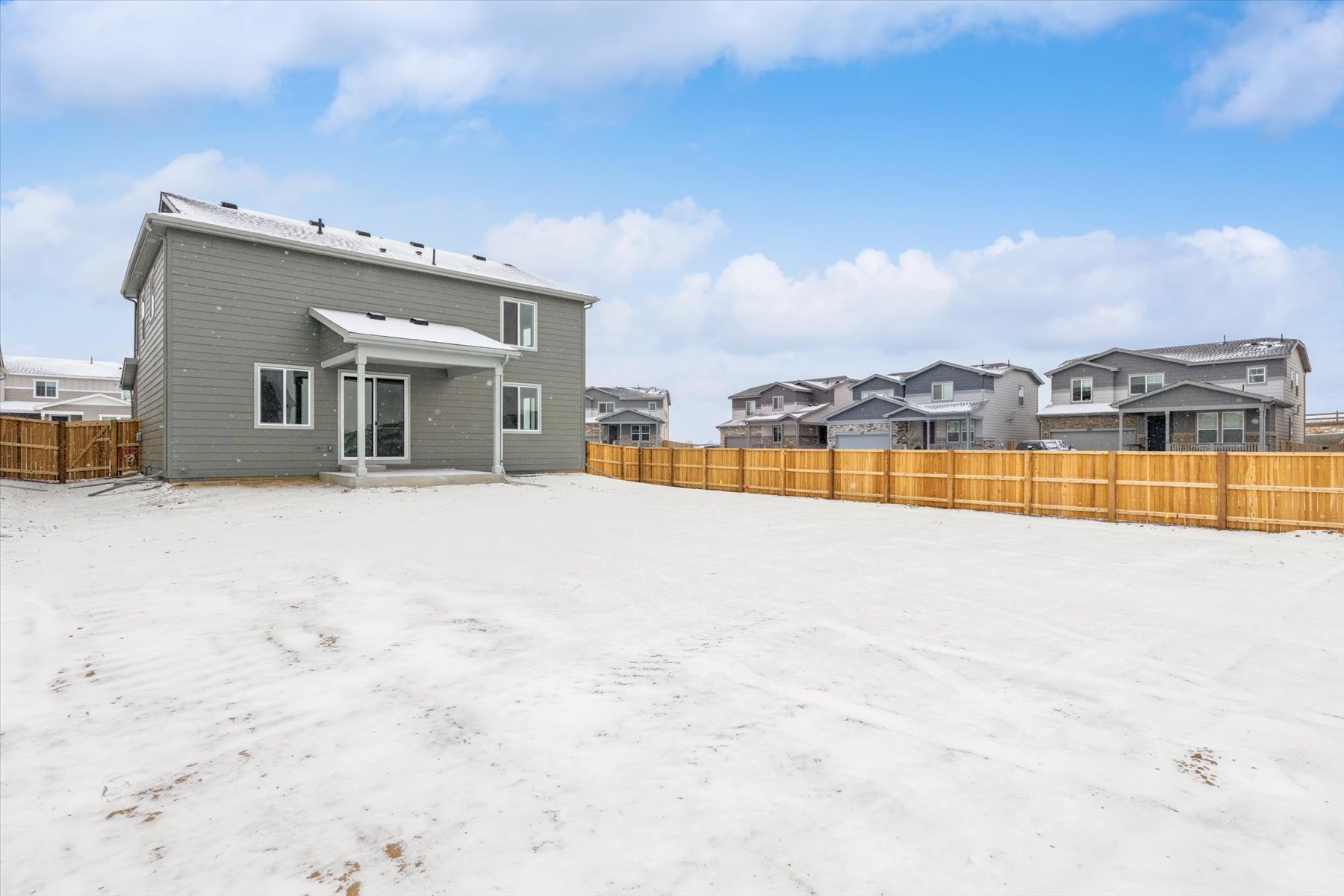 A group of houses in a snowy area.