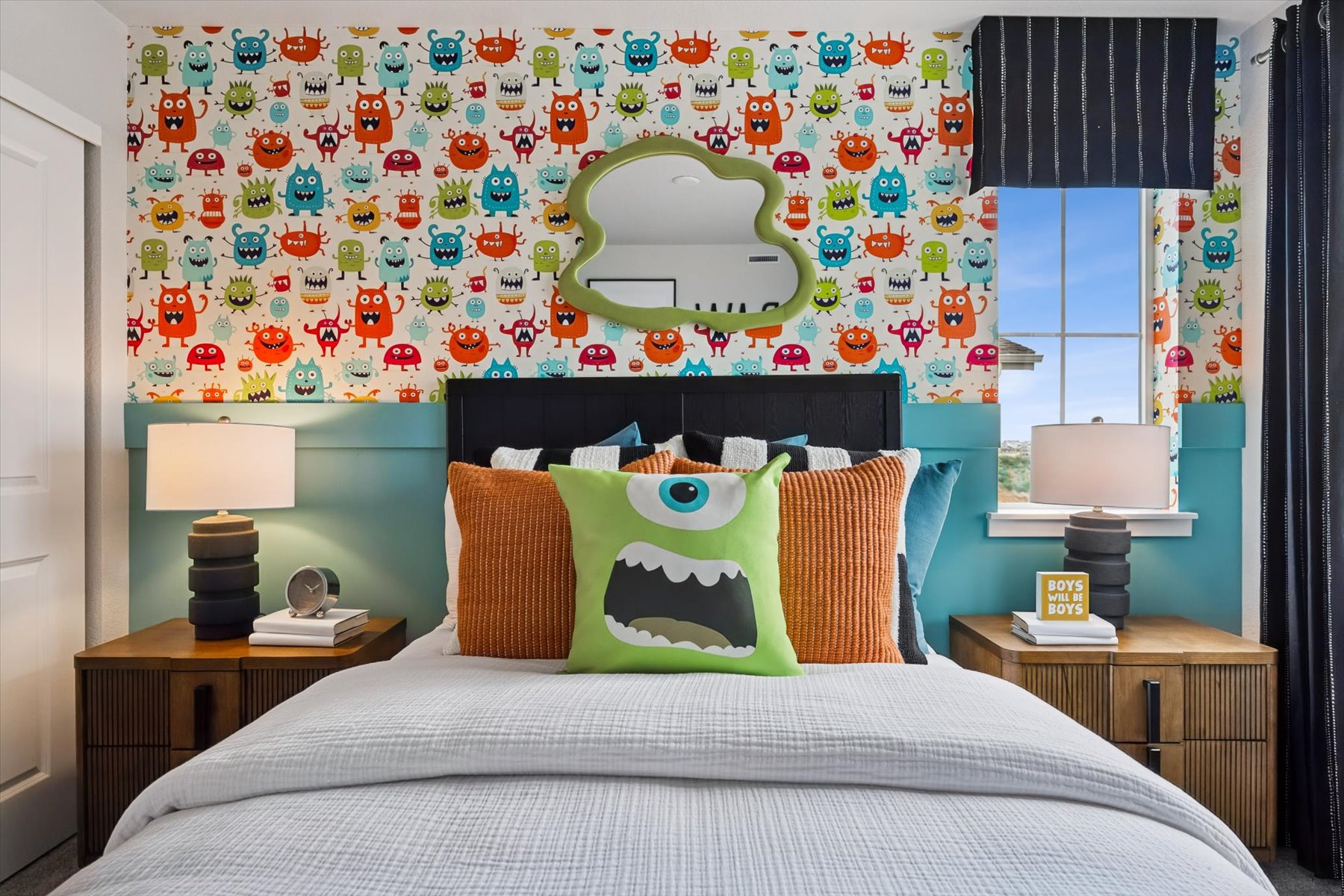 A bedroom with a bed and a mirror.