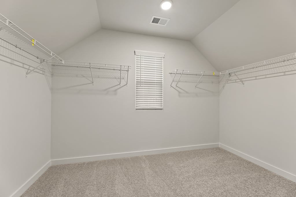 A white room with a staircase.