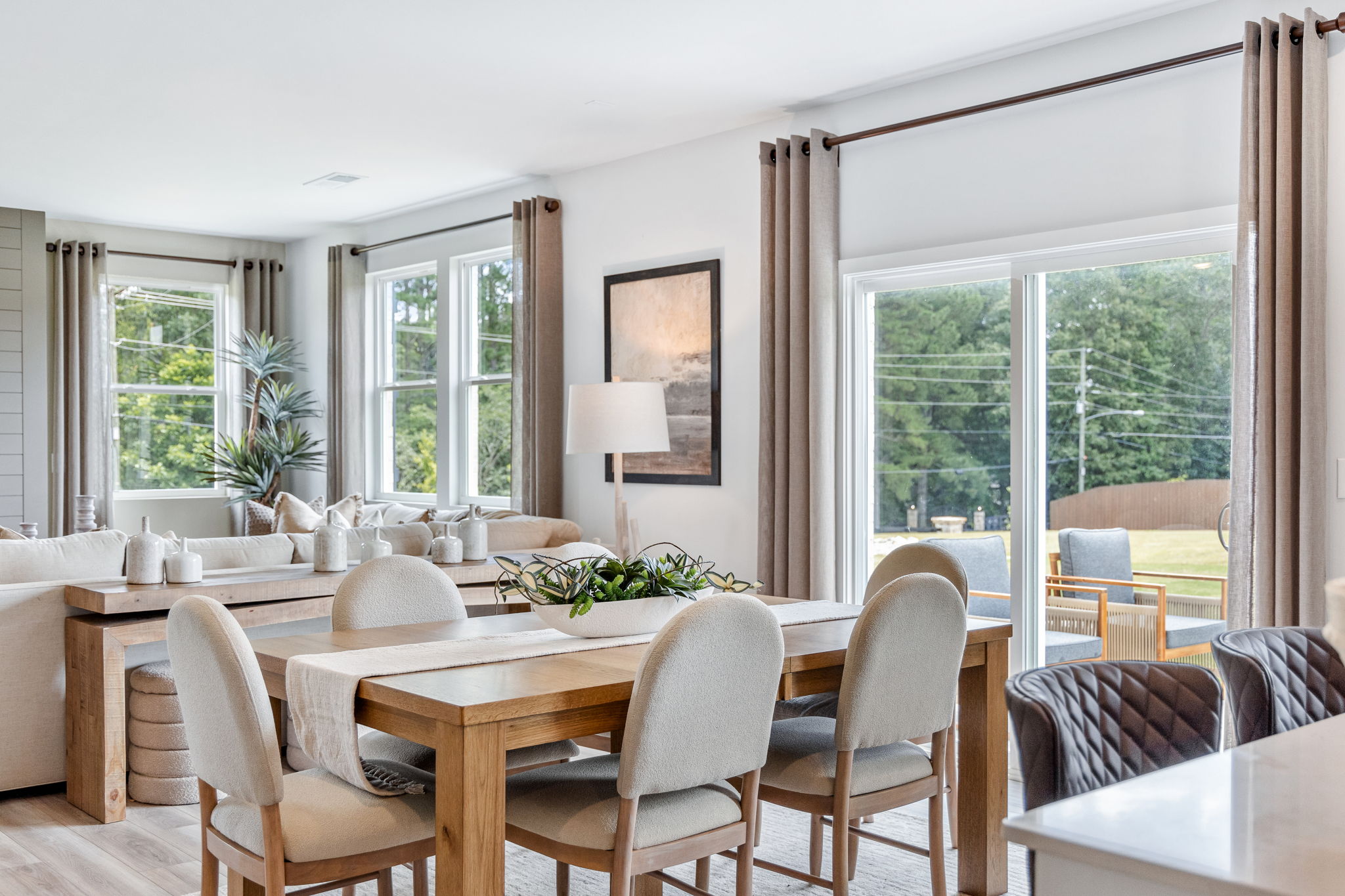 A dining room with a large window.
