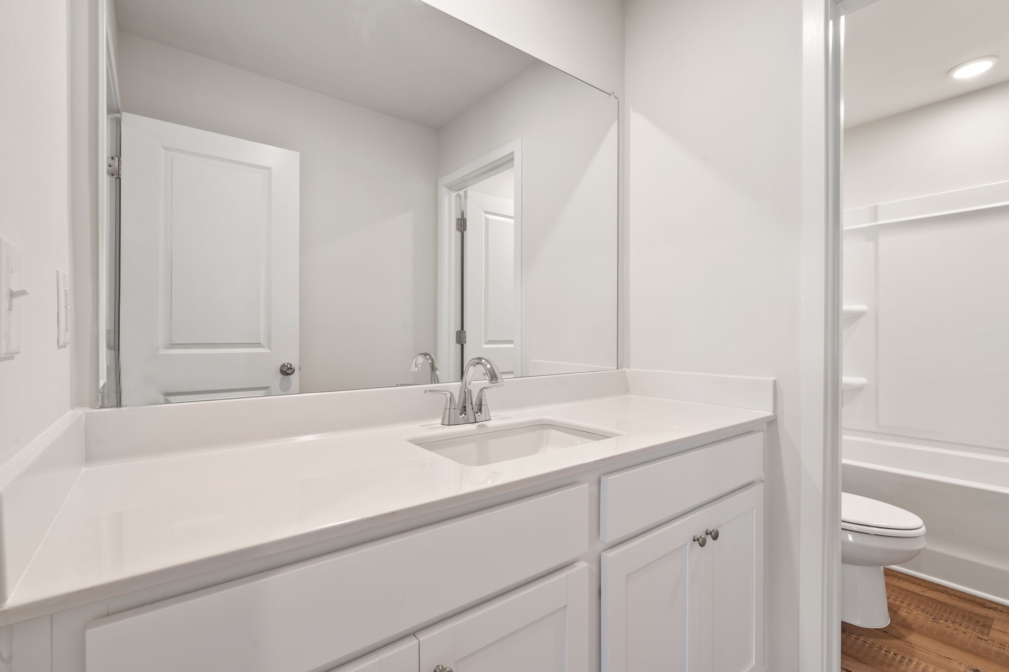 A bathroom with a sink and toilet.