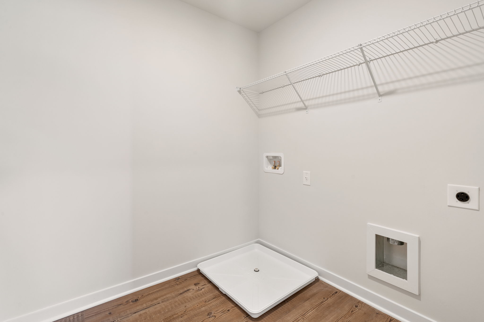 A white room with a white wall.