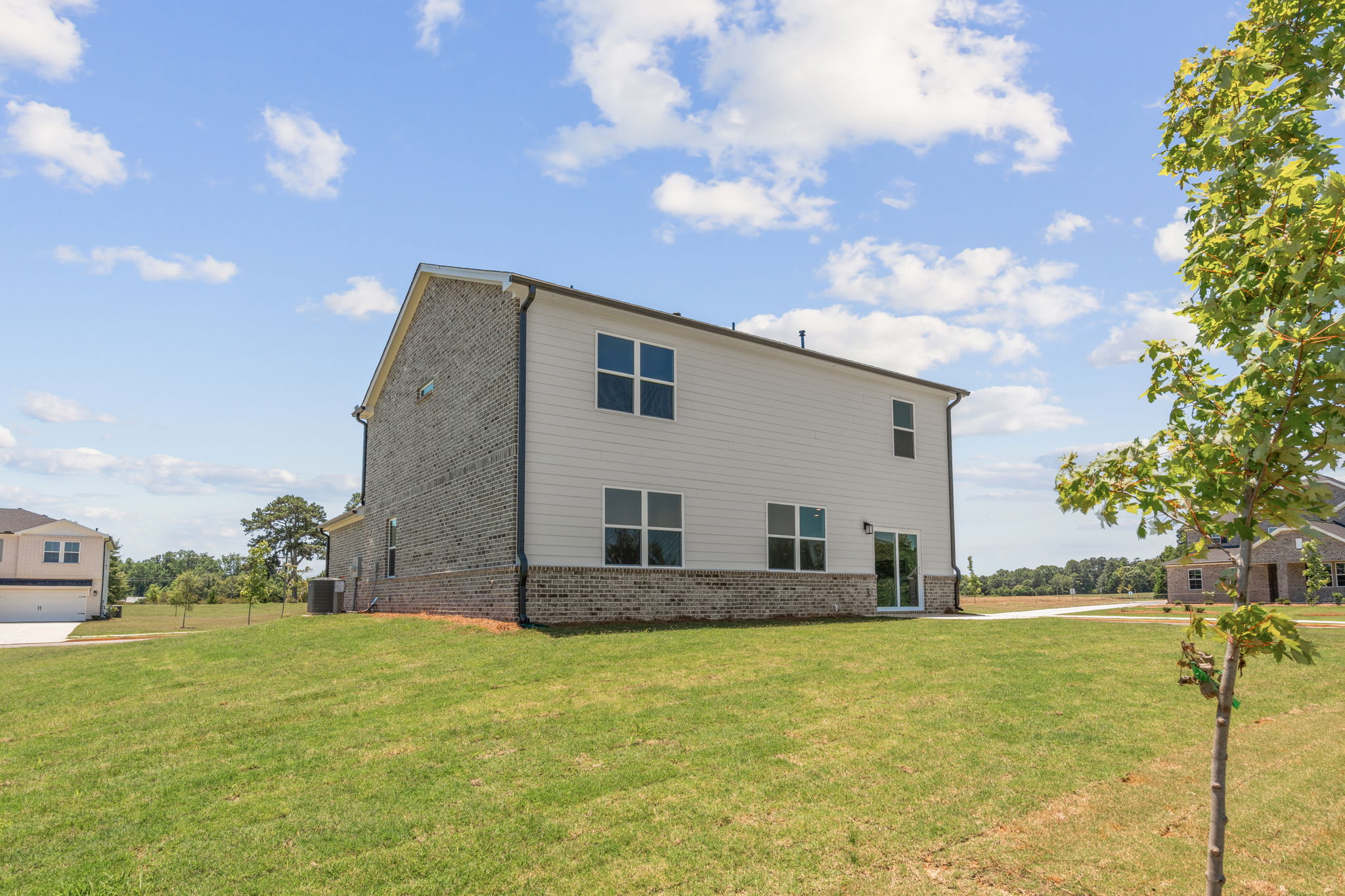A house with a grass yard.