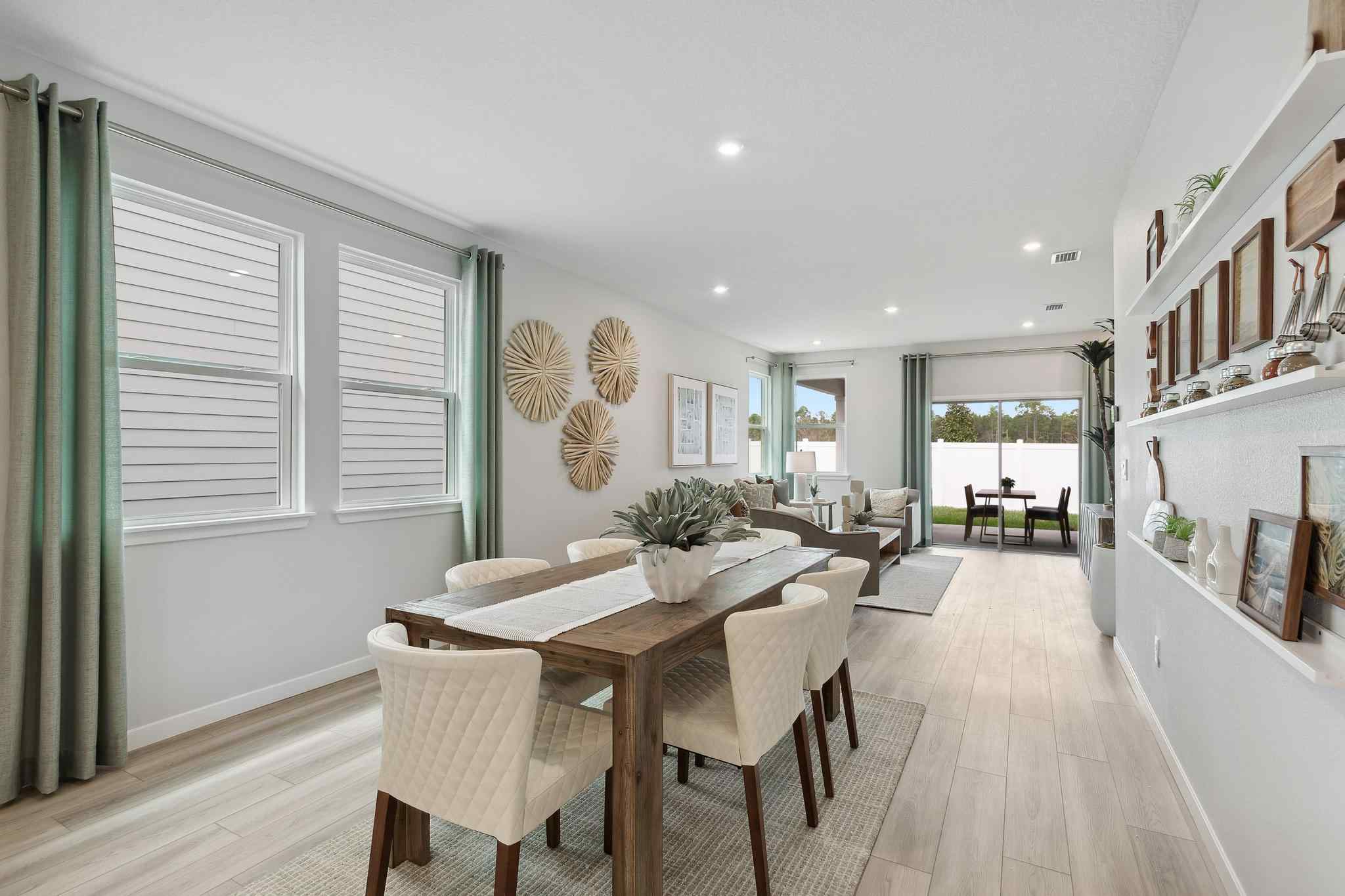 A dining room with a large table.