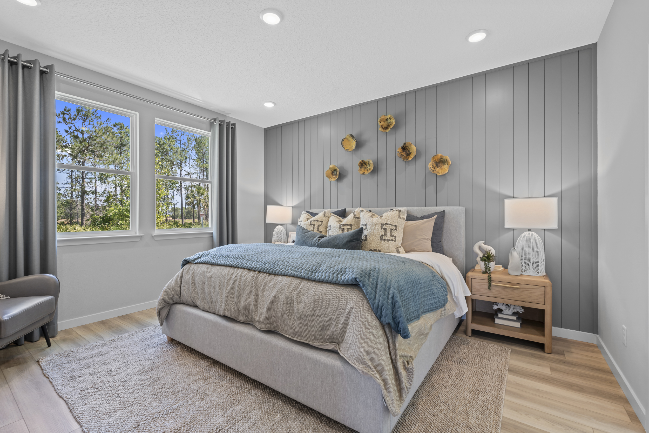 Coronado Model Home Primary Bedroom with Large Bed at Reserve East in Flagler Beach