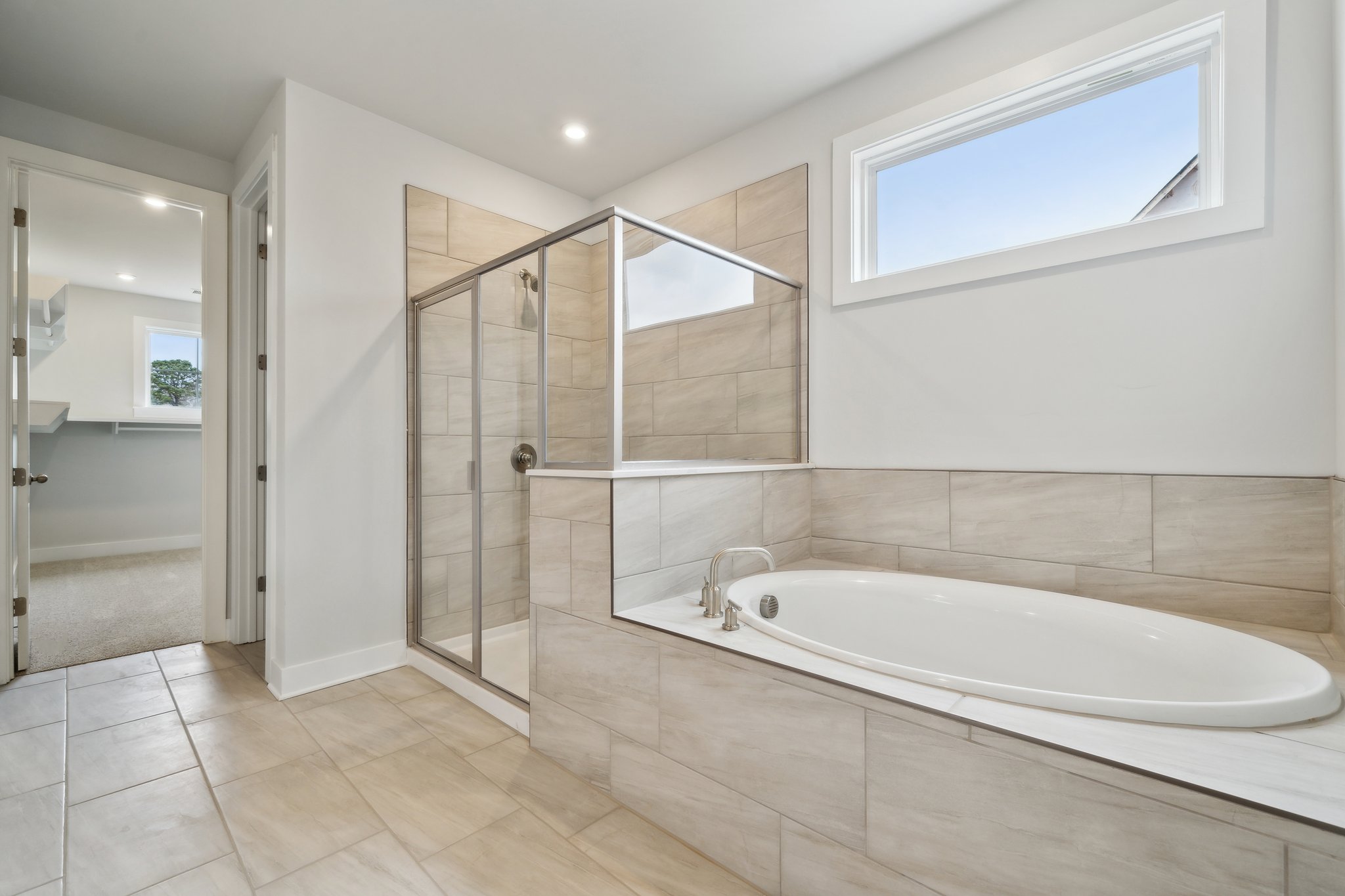 A bathroom with a tub and shower.