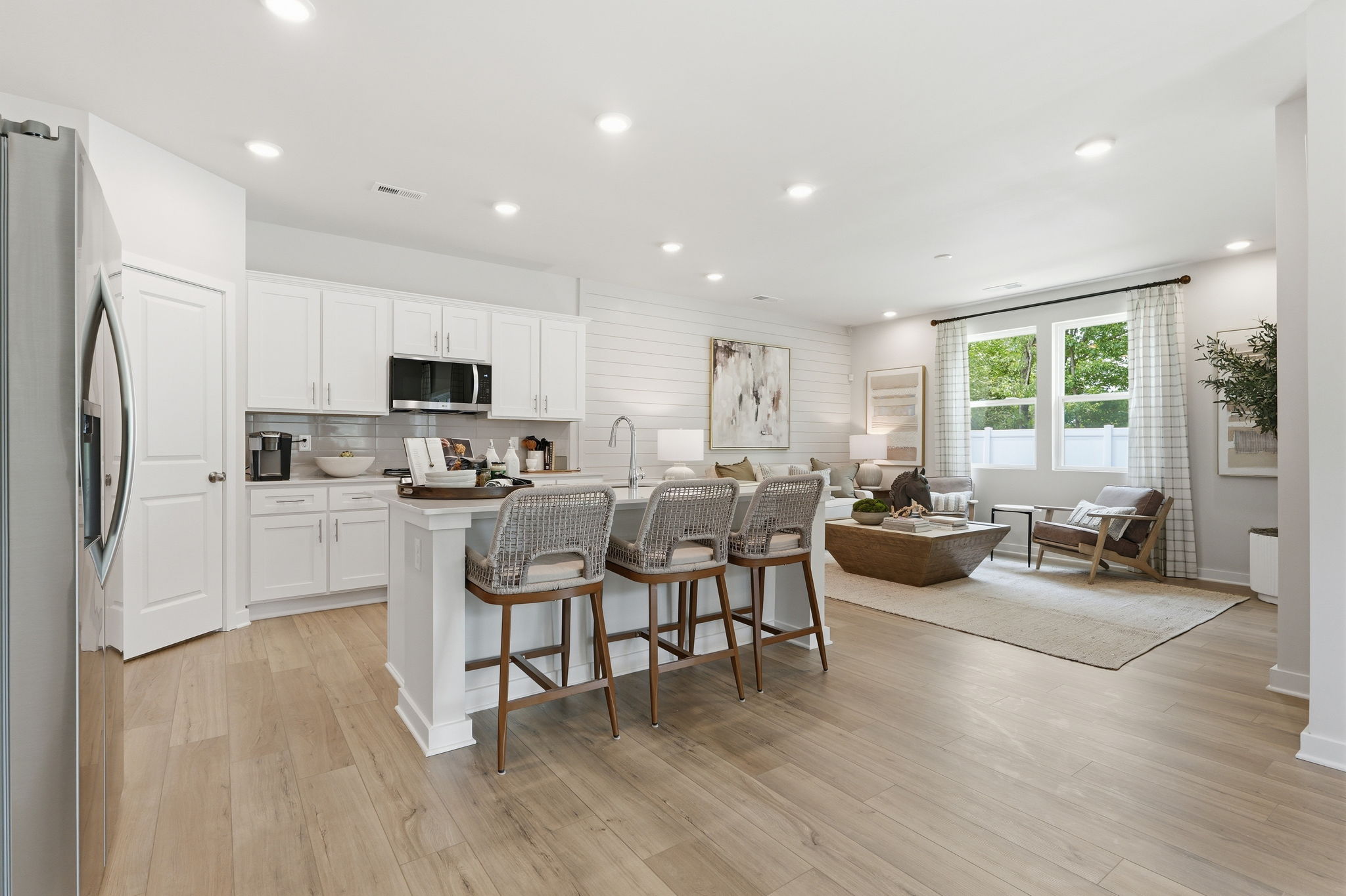 A kitchen with a wood floor.