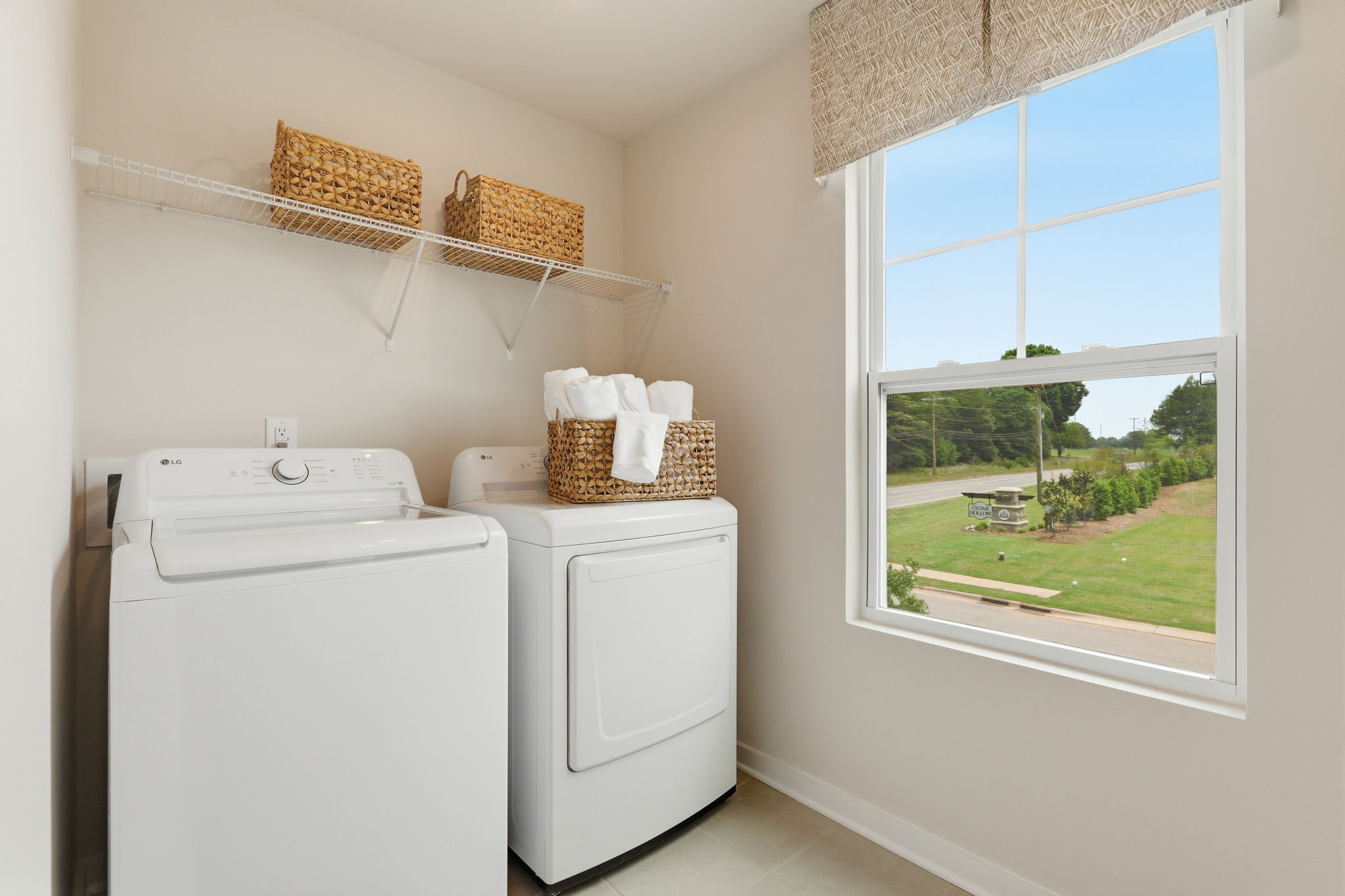 A laundry room with a window.