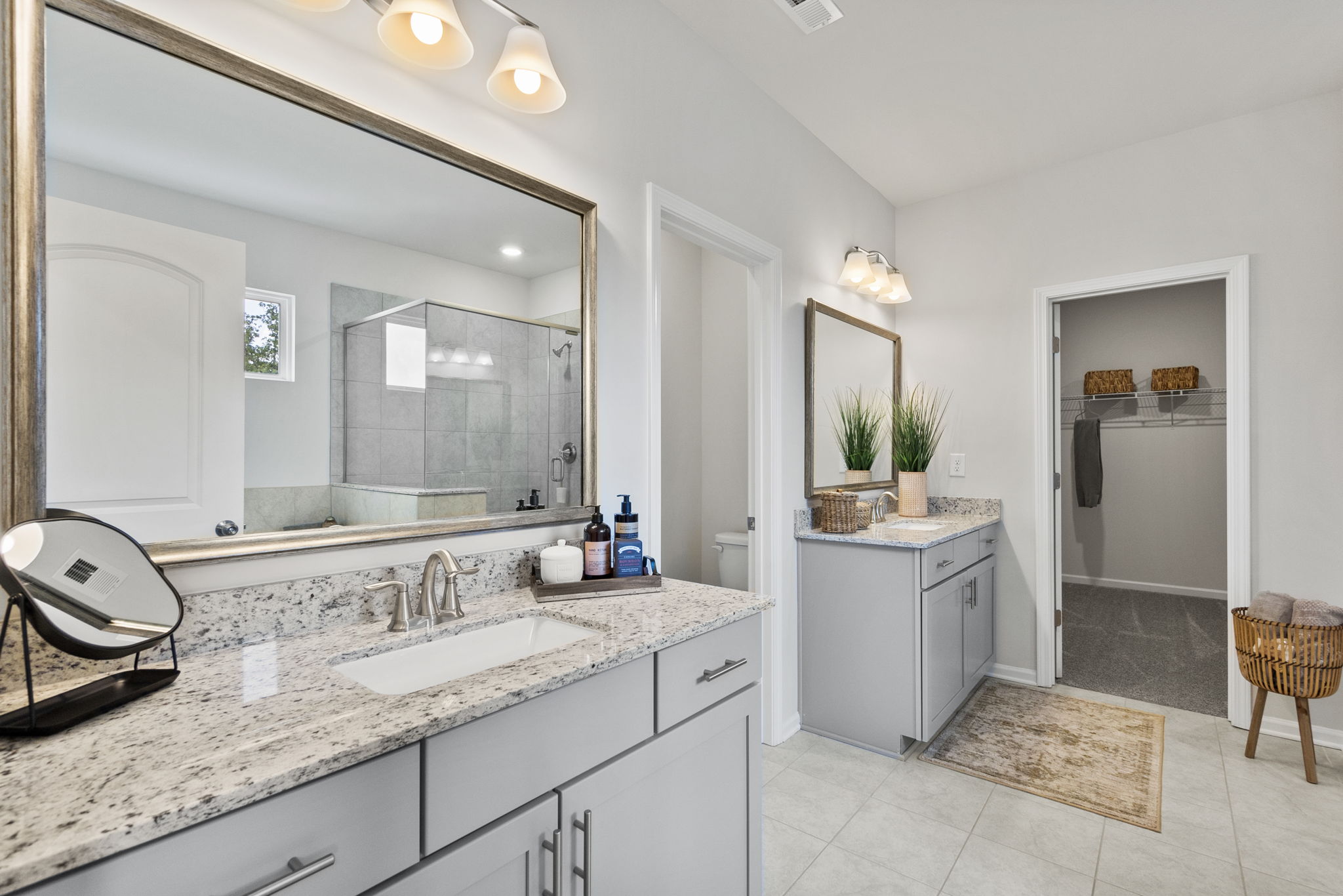 A bathroom with a large mirror.