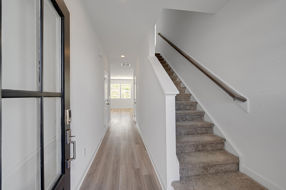 A long hallway with white walls.