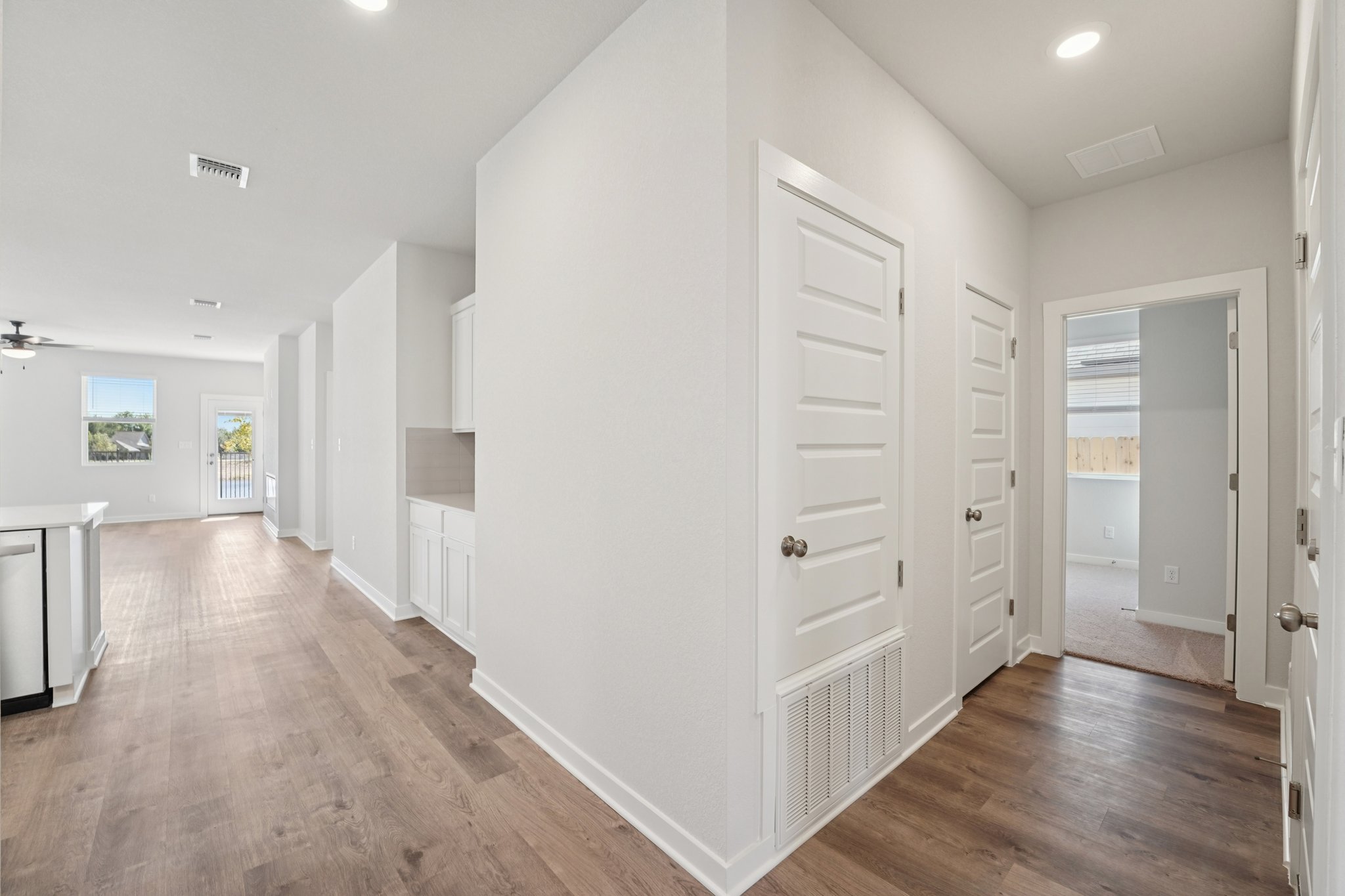 A room with white cabinets.
