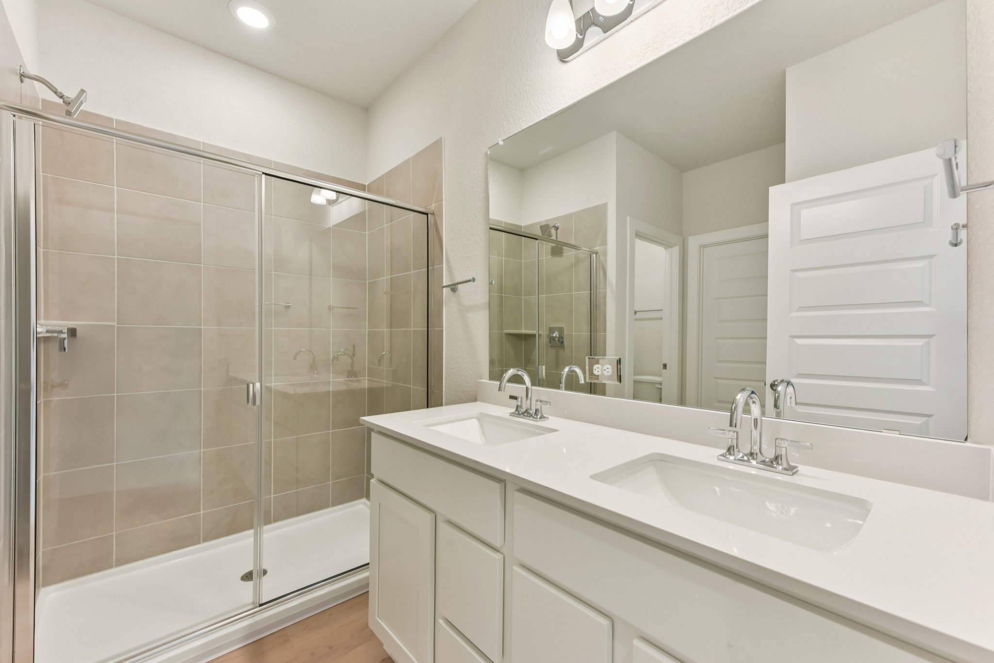 A bathroom with a glass shower.