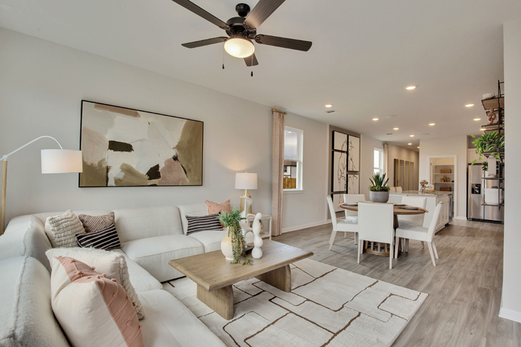 A living room with a couch and a table.