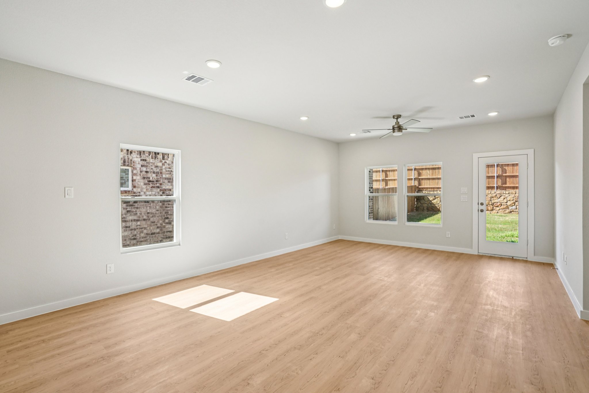 A room with a wood floor and a wood floor with a wood floor.