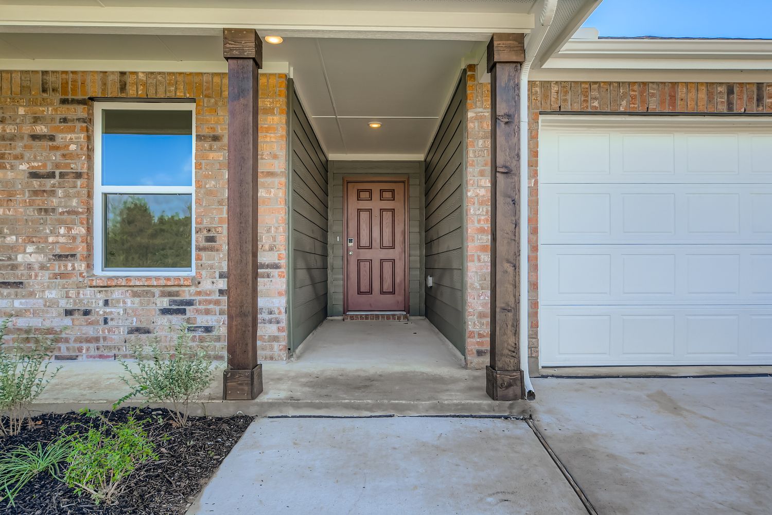 A building with a garage door and a garage.