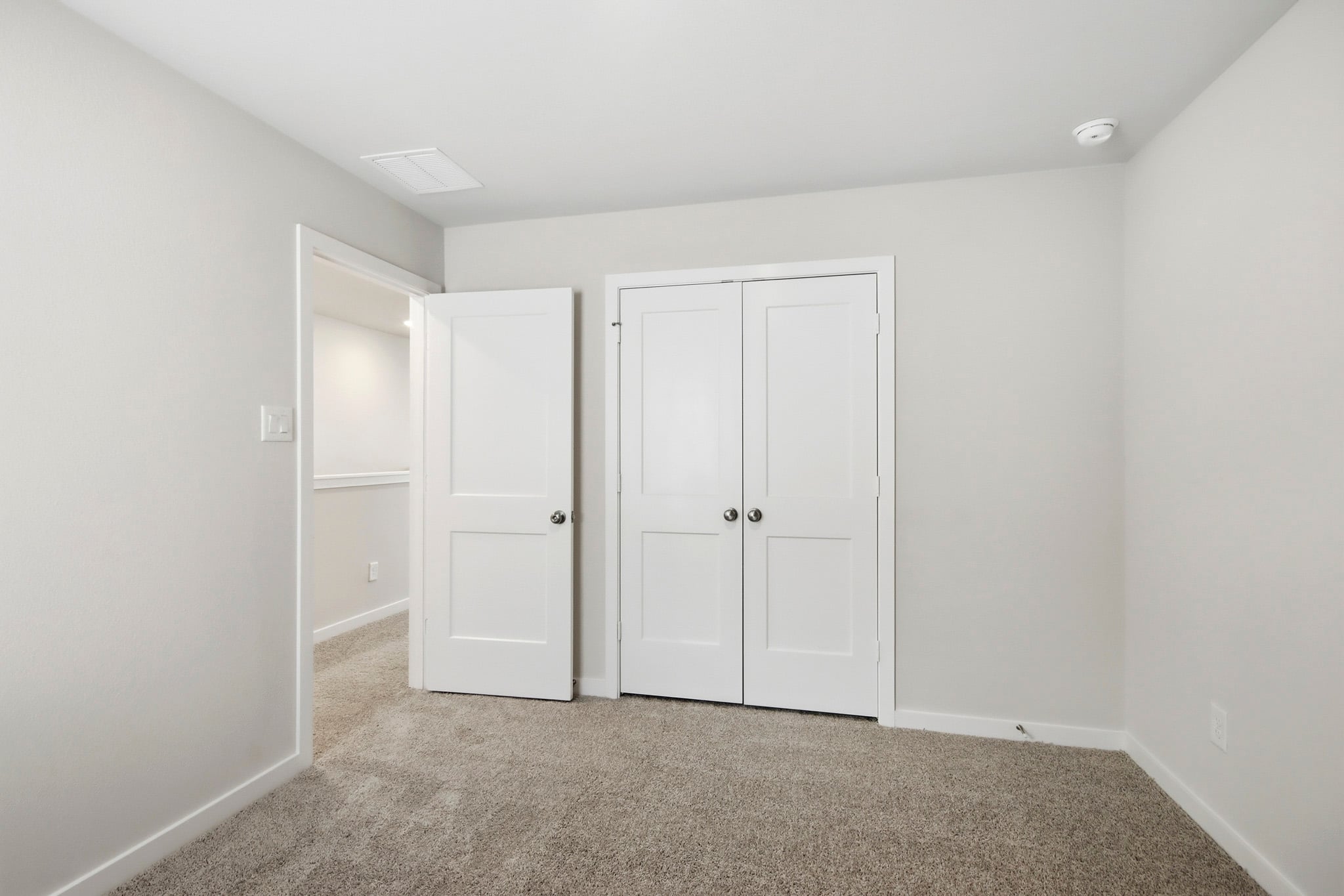 A room with white doors.