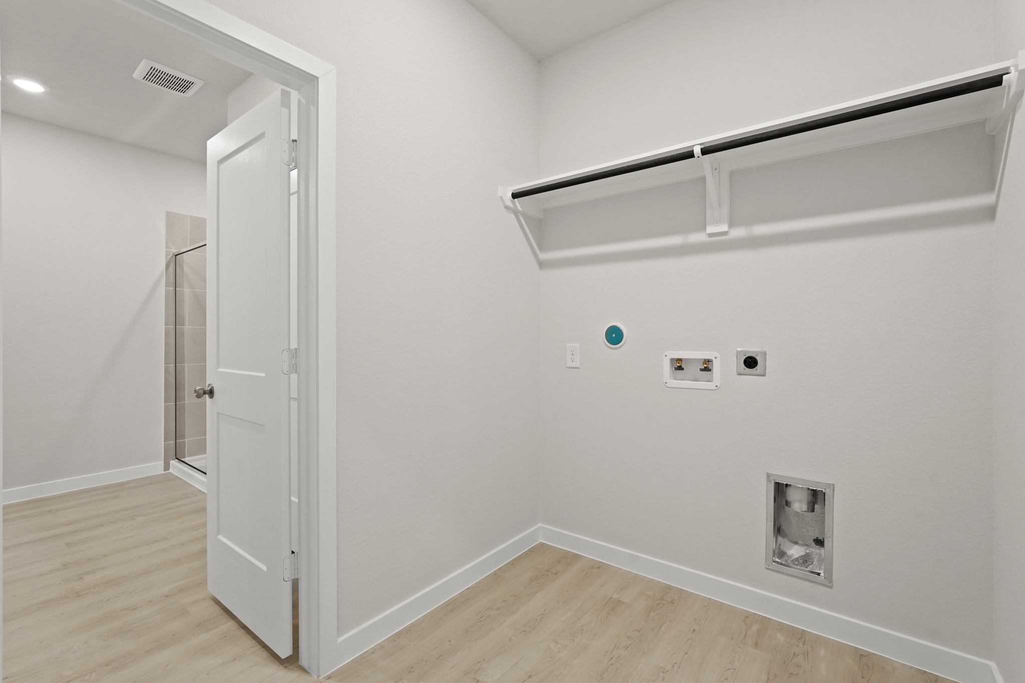 A white room with a white door.