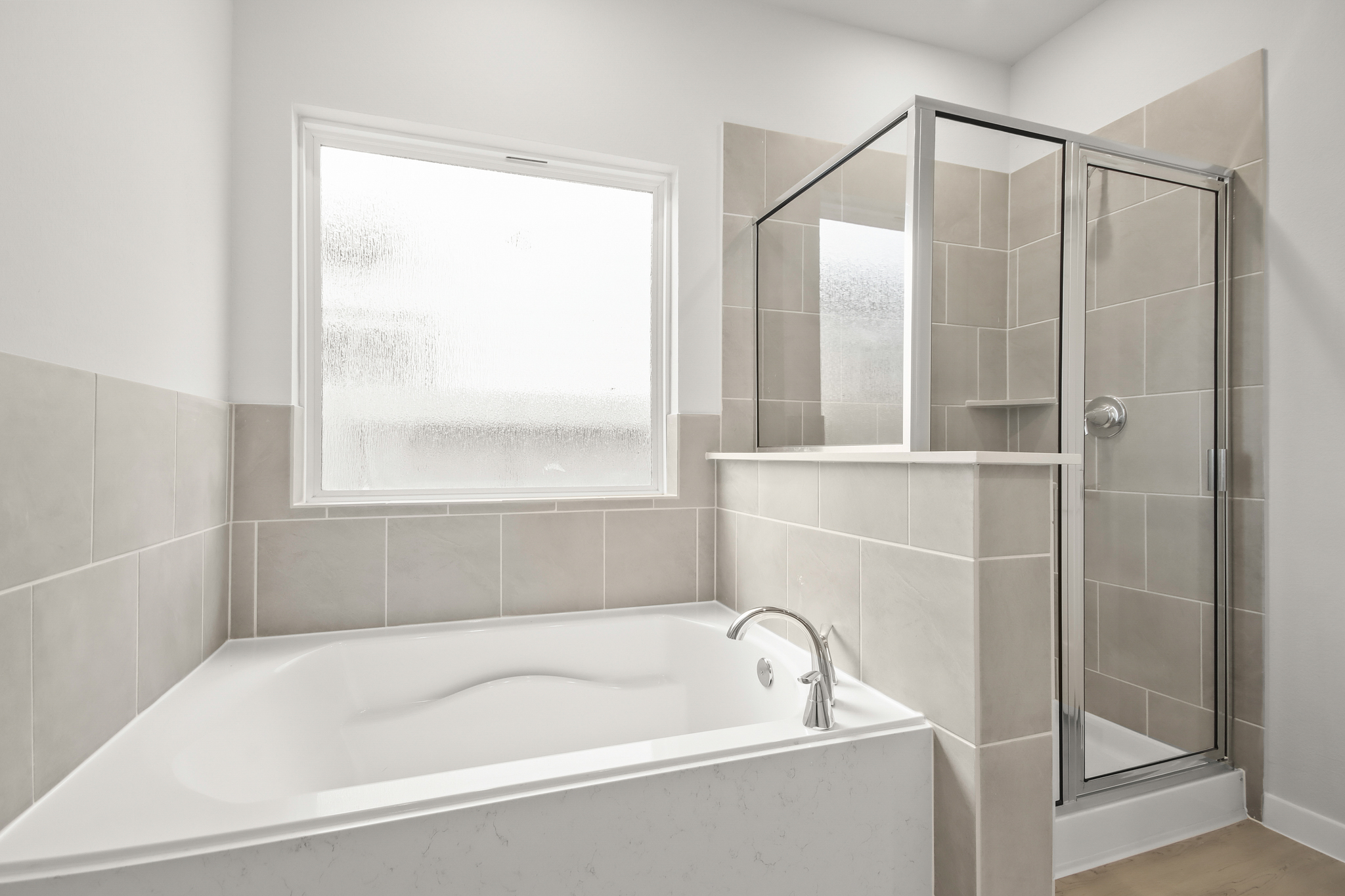 A bathroom with a glass shower.