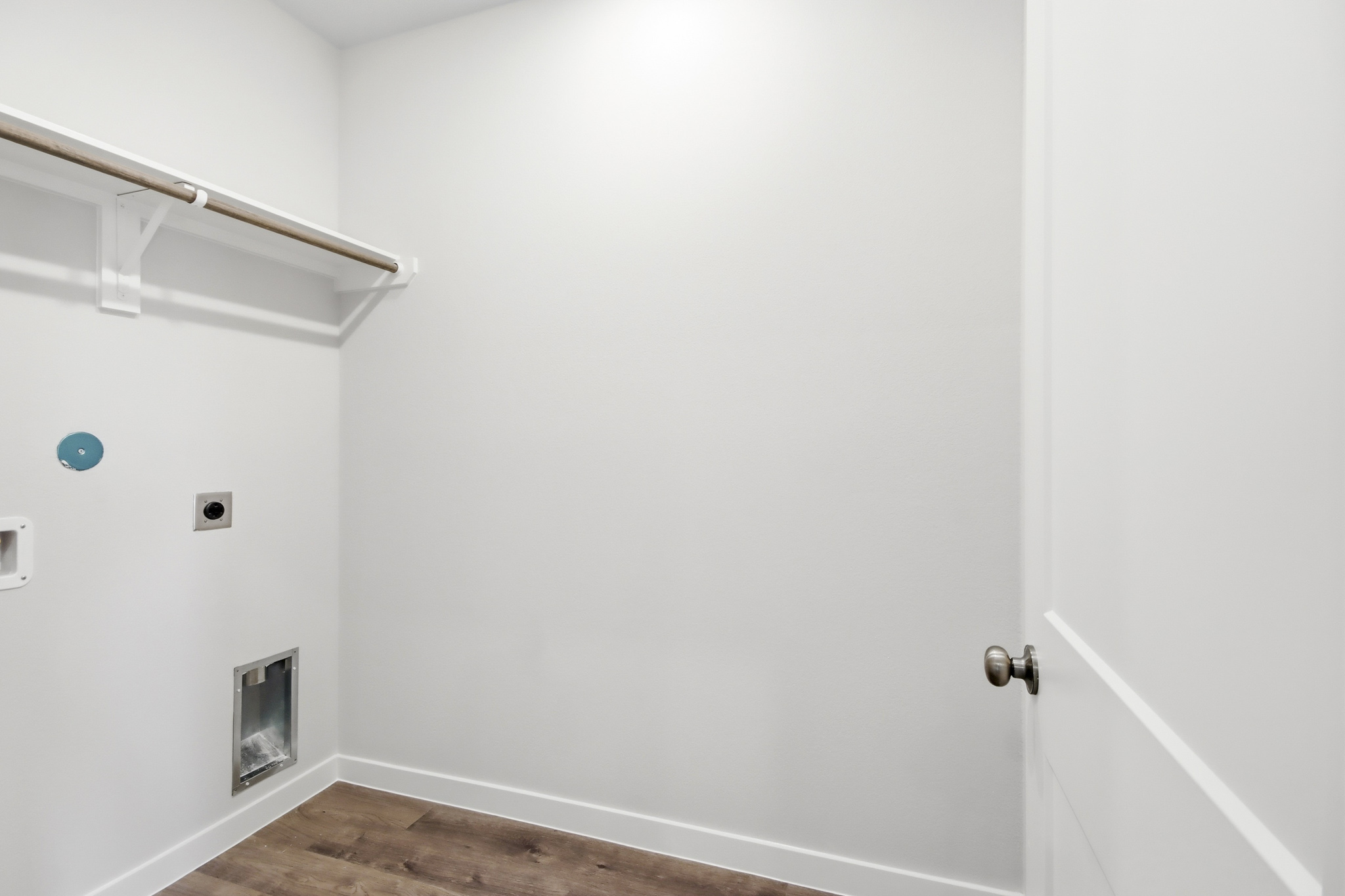 A white door with a blue ball.