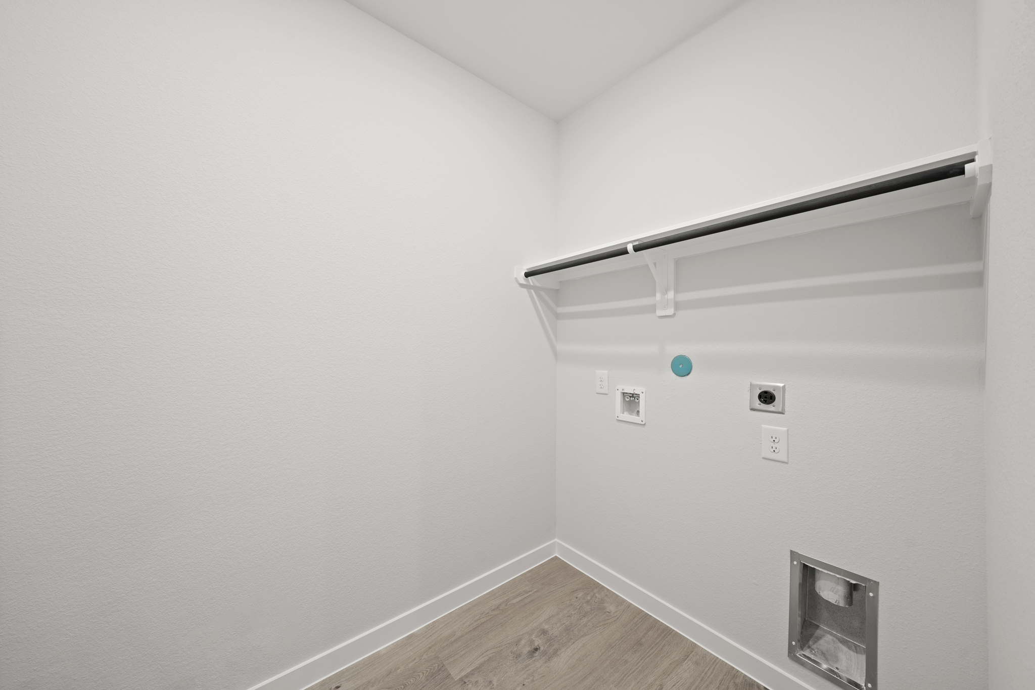 A white wall with a light on it.