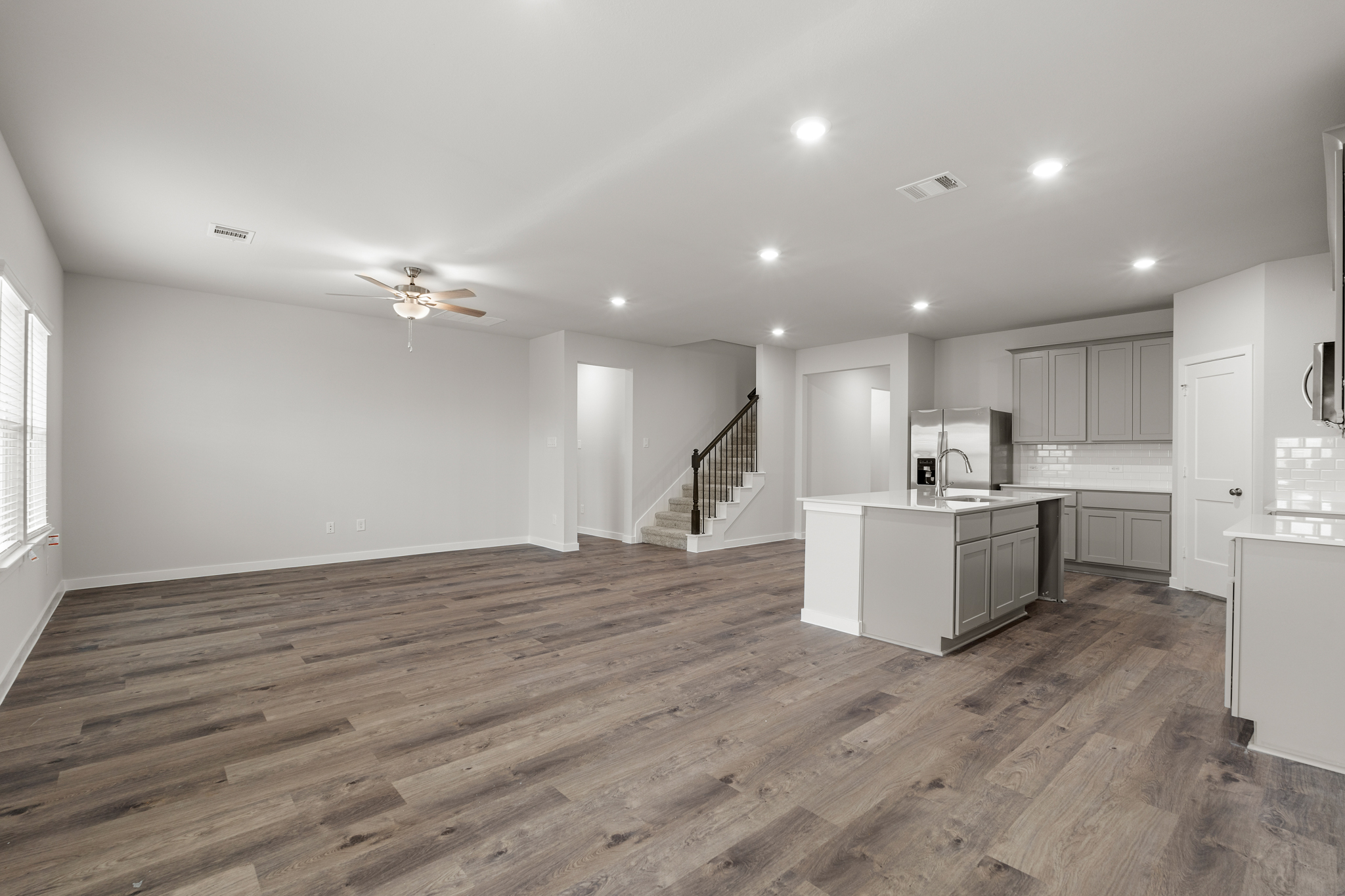 A large kitchen with white cabinets.