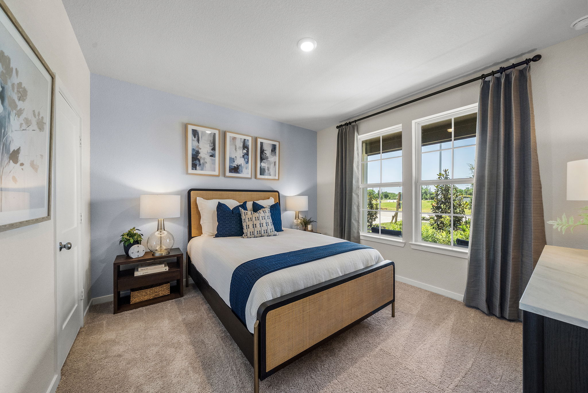 A bedroom with a bed and a window.