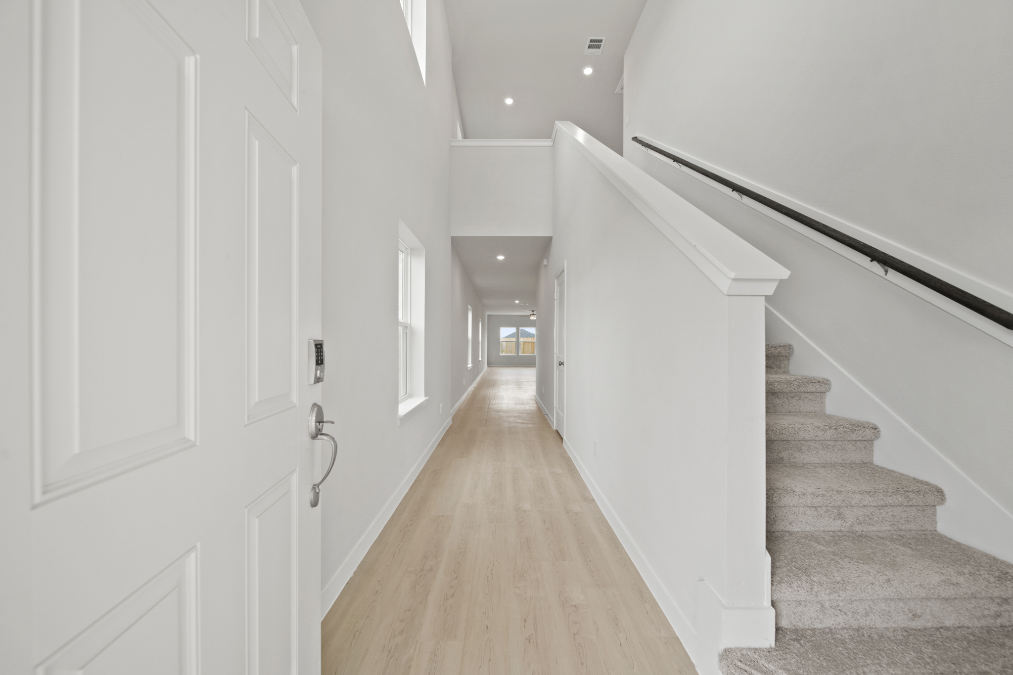 A hallway with white doors.