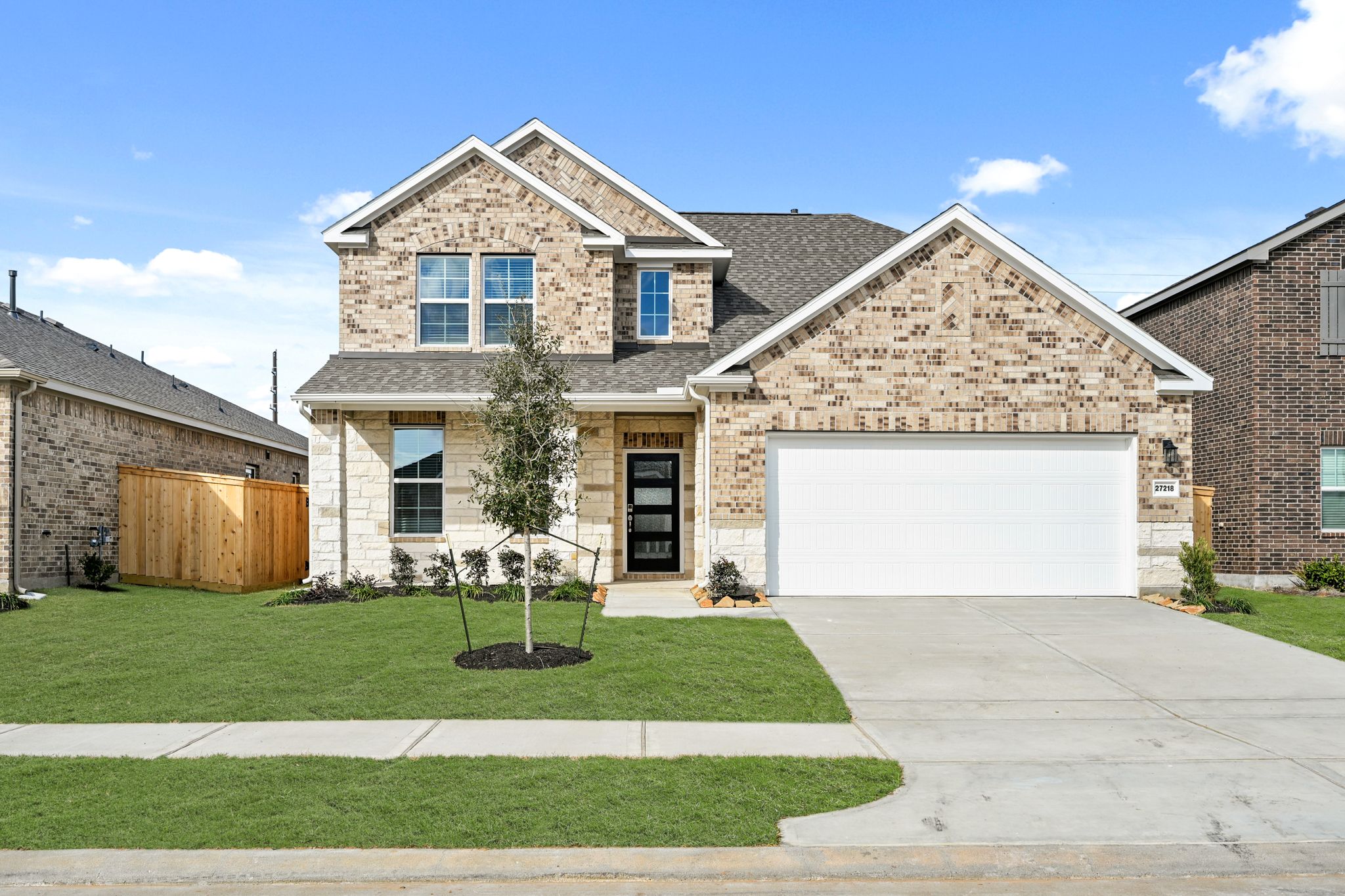 A large house with a garage.