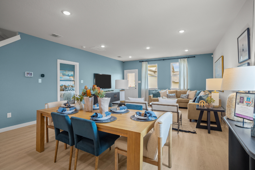 A room with a table and chairs.