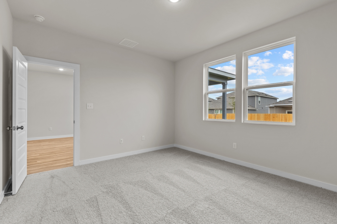 A room with a window and a door.