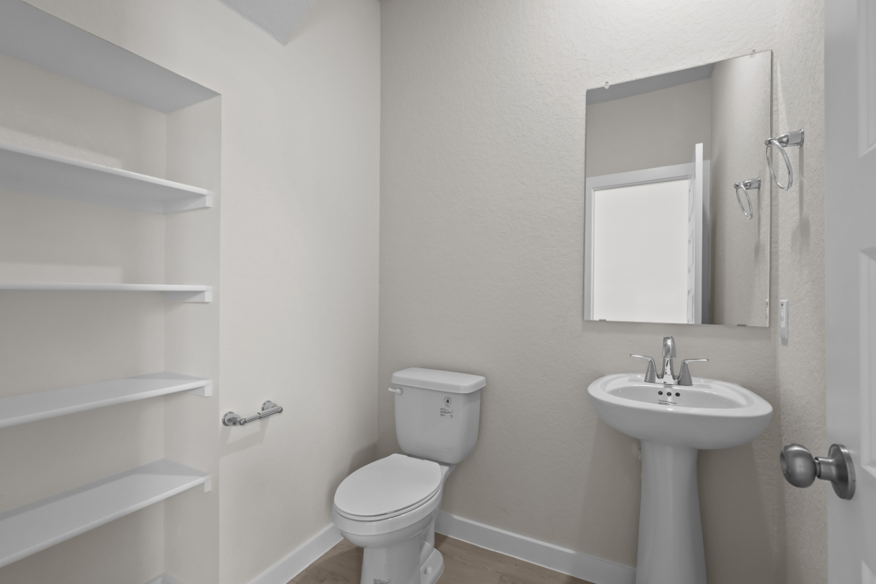 A bathroom with a sink and toilet.