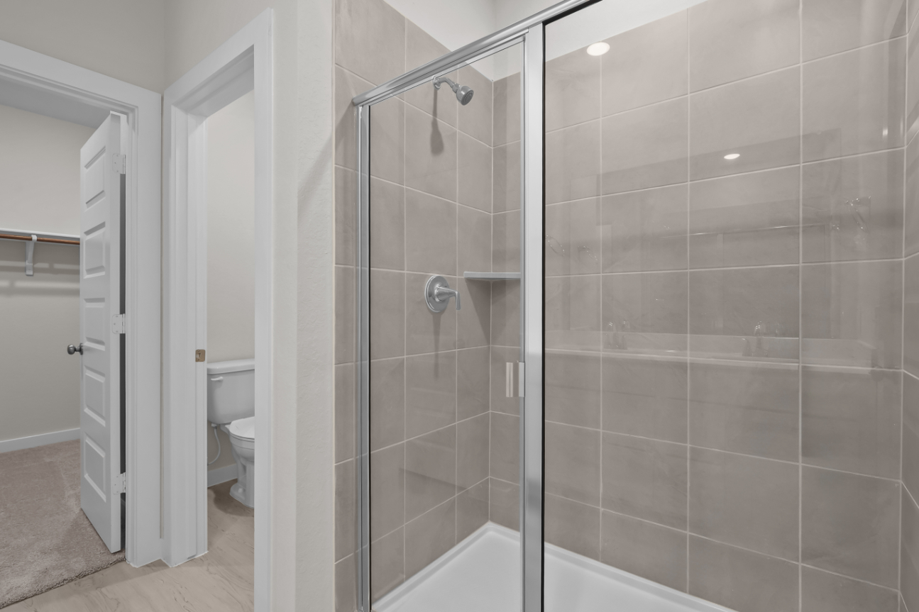 A bathroom with a glass shower.