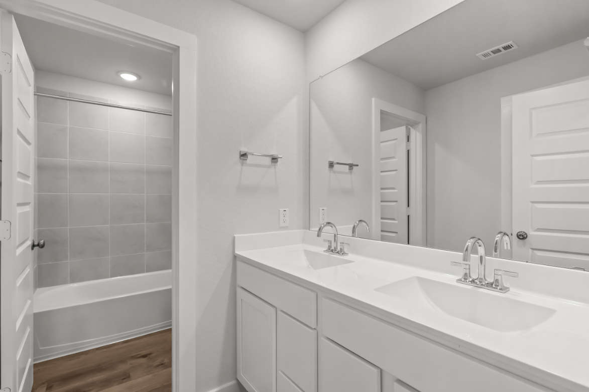A bathroom with a glass shower.