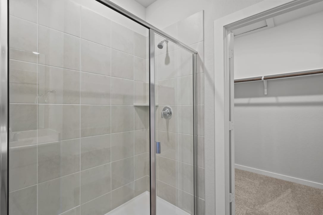A shower with a glass door.