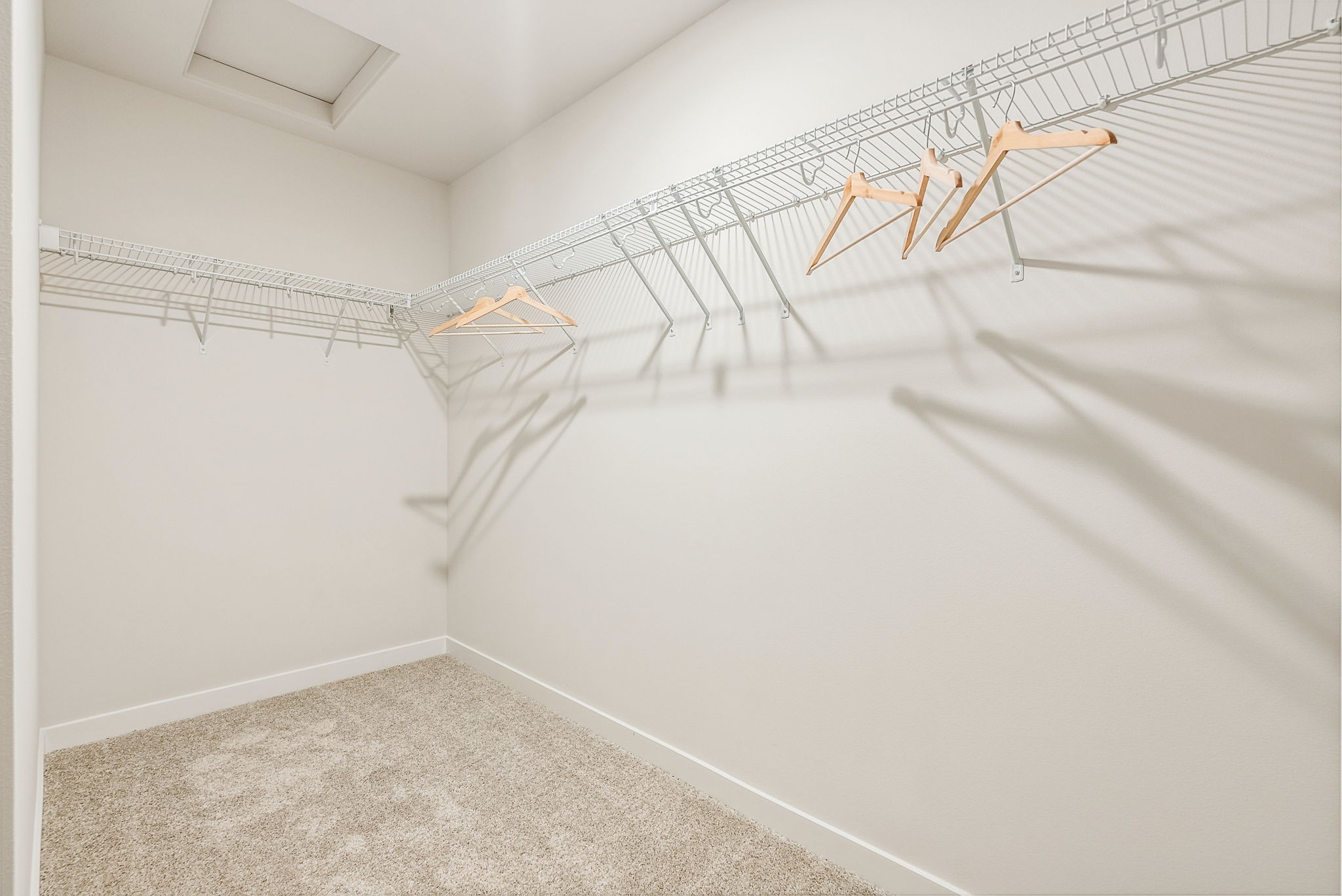 A white hallway with a white wall.